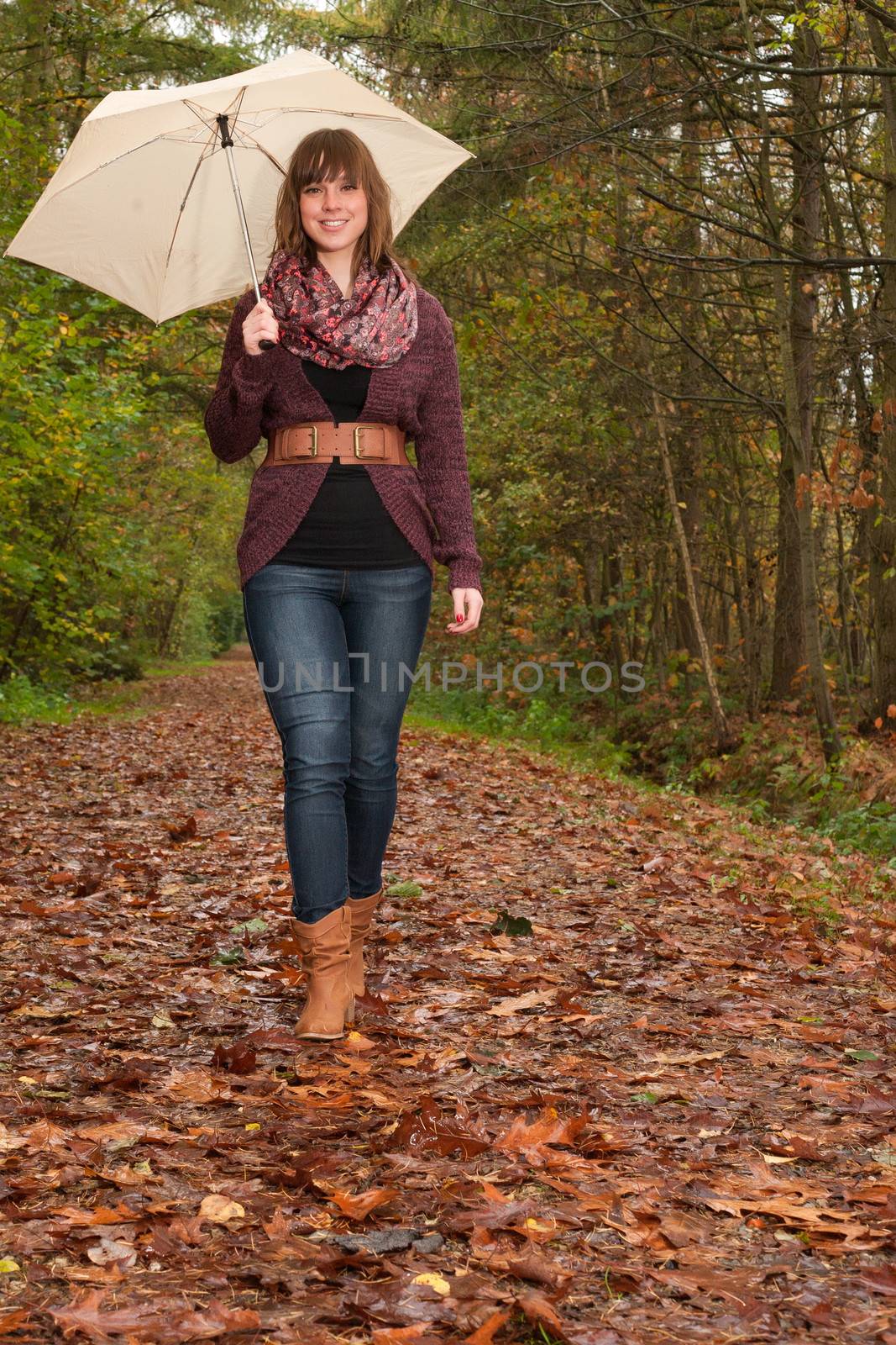 Young woman in the autumn at a cold november day