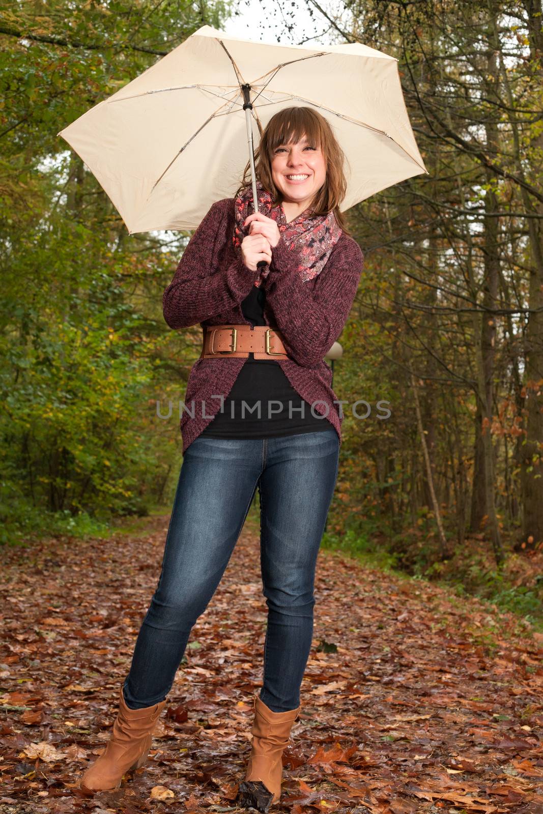 Young woman in the autumn at a cold november day