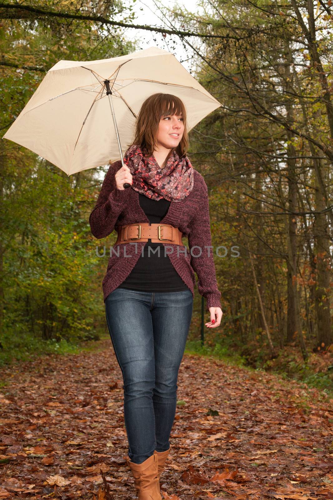 Young woman in the autumn at a cold november day
