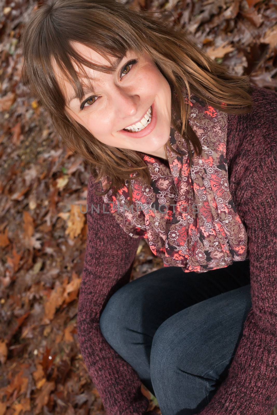 Young woman in the autumn at a cold november day