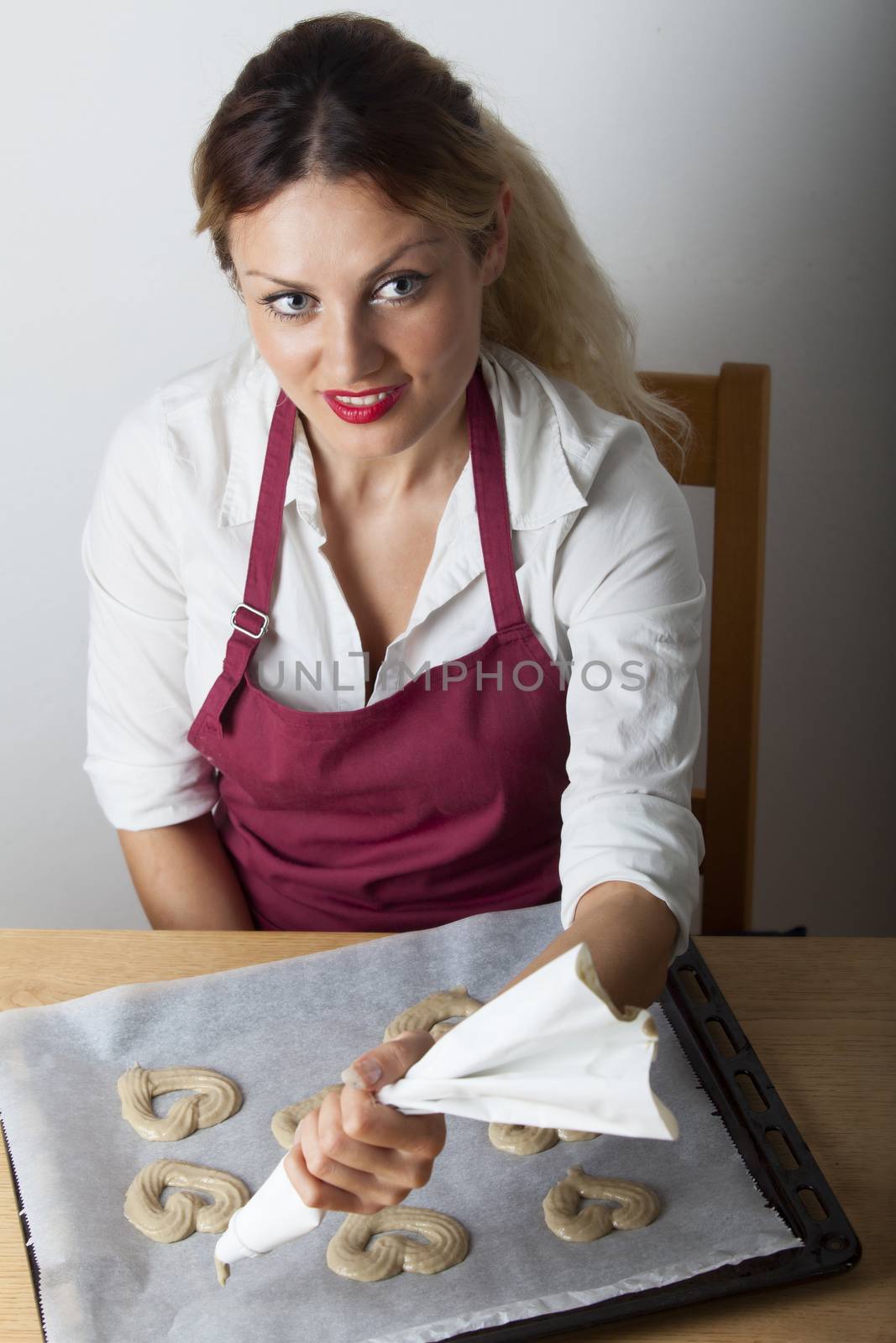 young chef baking pastry by bernjuer