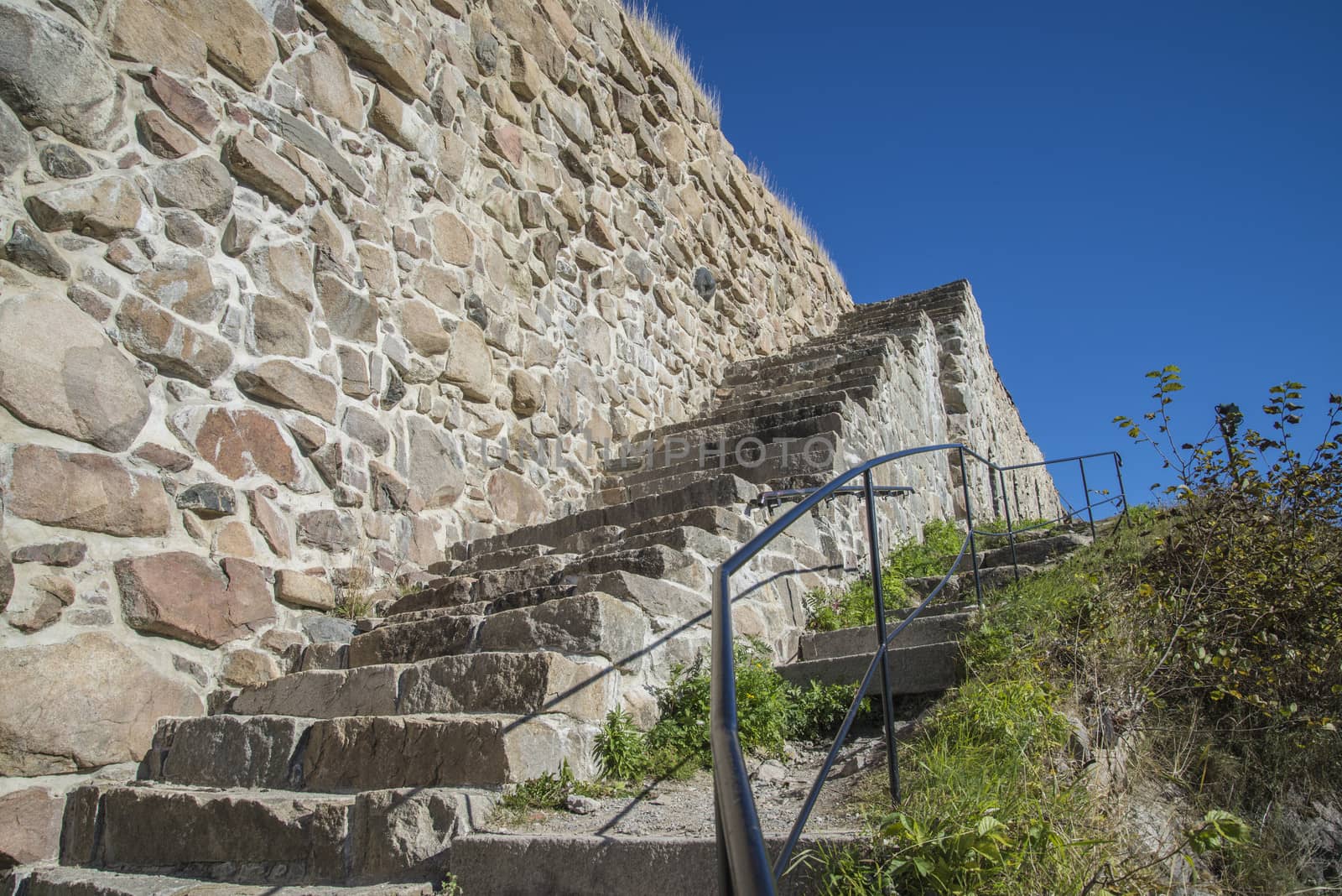 The image is shot in September 2013 at Fredriksten Fortress in Halden, Noway and shows the Large powderhouses and Northern curtain wall that protects the Citadel to the west and connects Queen's bastion with Prince Chritians bastion, the curtain wall was completed in 1668