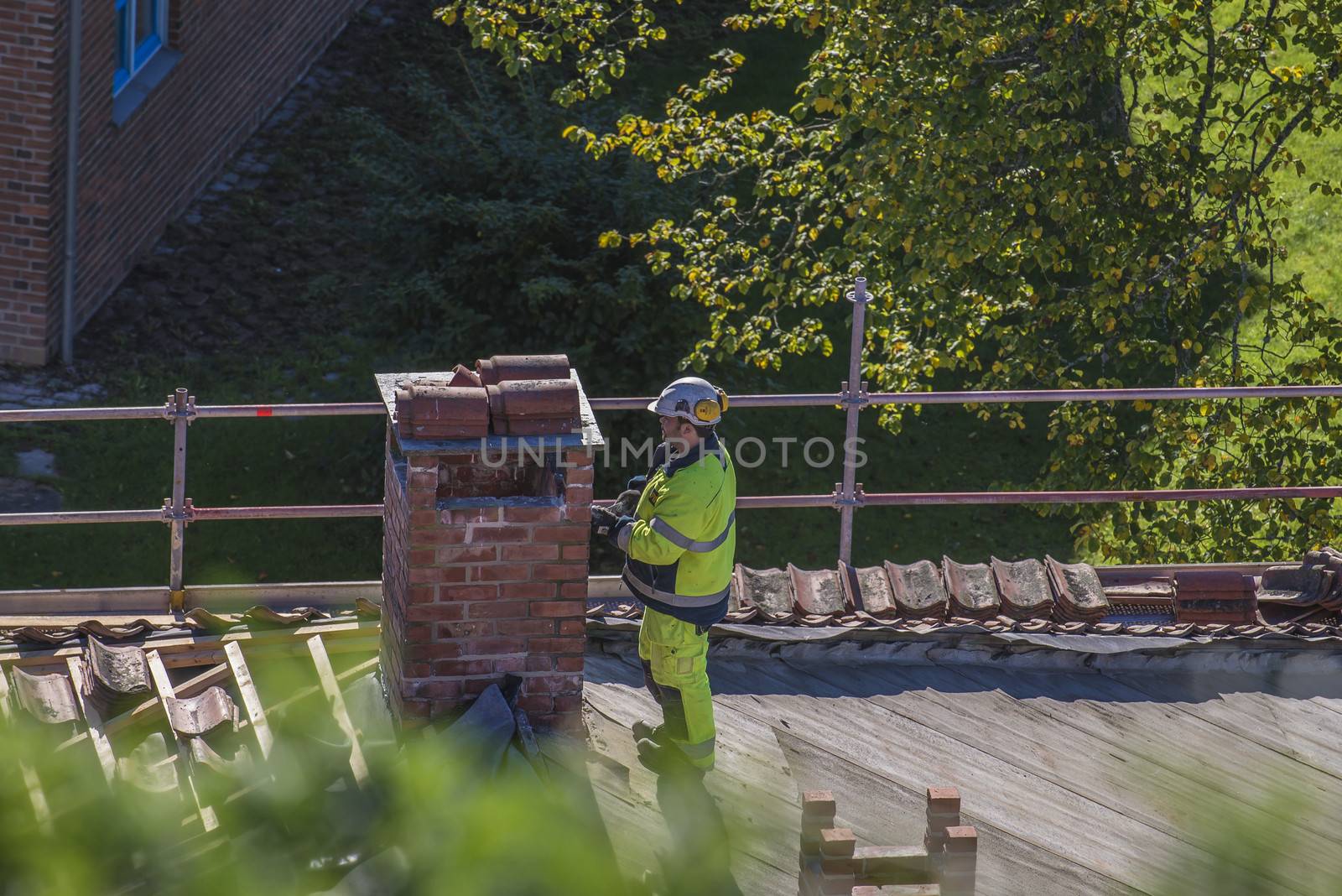 The school building at Fredriksten fortress in Halden, Norway is a major Maintenance work on the roof and new grout on the chimneys. Photo is shot in September 2013.