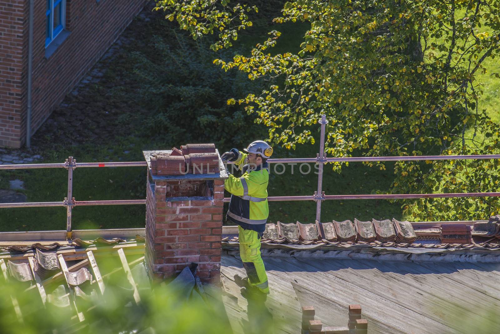 The school building at Fredriksten fortress in Halden, Norway is a major Maintenance work on the roof and new grout on the chimneys. Photo is shot in September 2013.