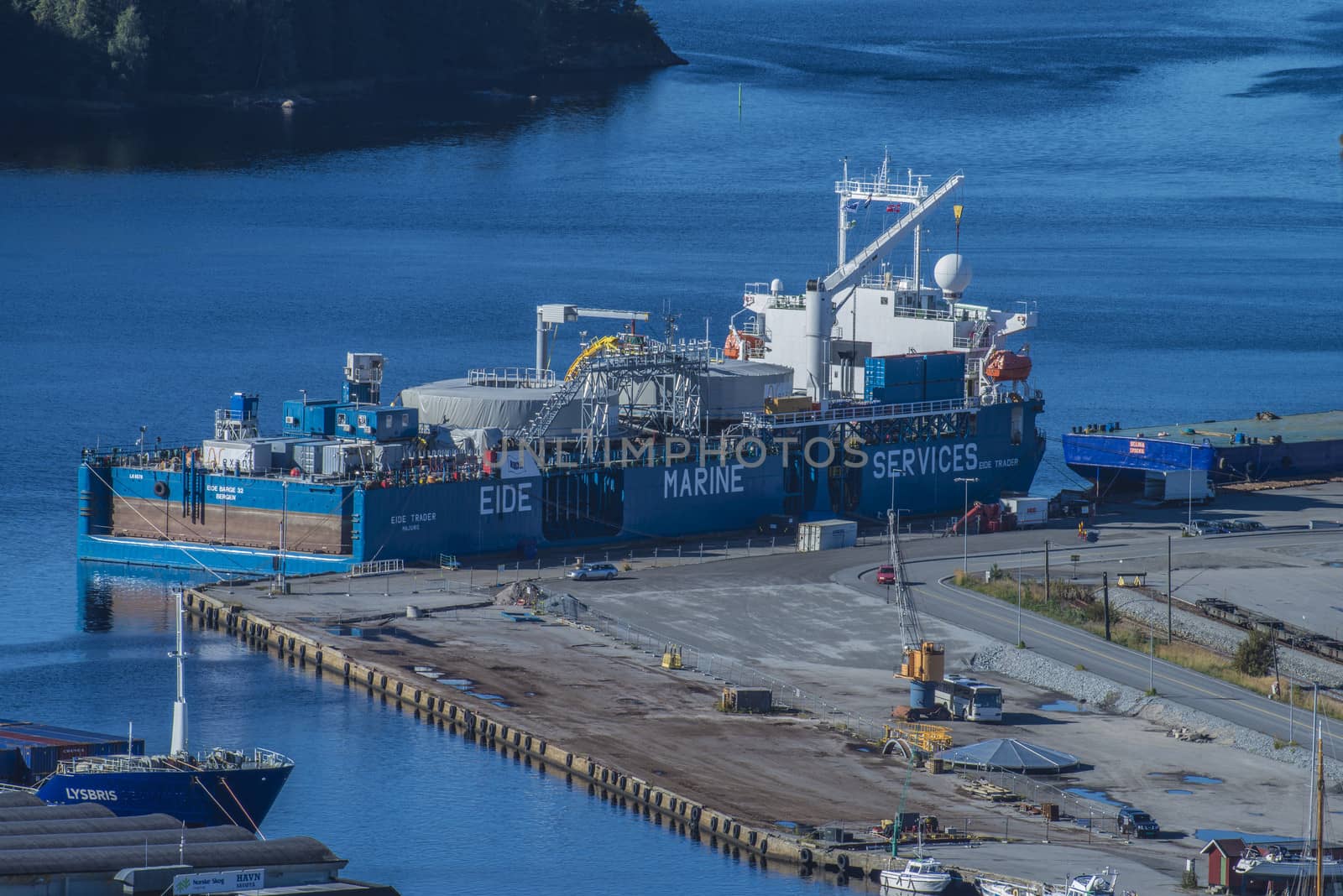 Image is shot from the top of Fredriksten fortress and shows the port of Halden, Norway and MV Eide Trader moored to the dock. Image is shot in September 2013