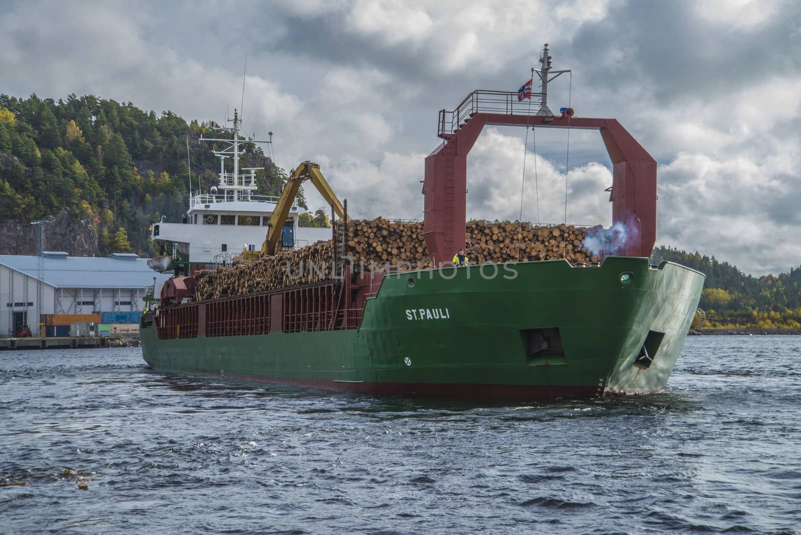 MV St.pauli leaving Halden, (Norway) harbor with a cargo full of timber. Photo is shot 9 October 2013. Vessel's Details: Ship type: General cargo, Year Built: 1983, Length x breadth: 92 m X 15 m, Gross Tonnage: 3075, Dead Weight: 3219 t, Flag: Gibraltar (GI).
