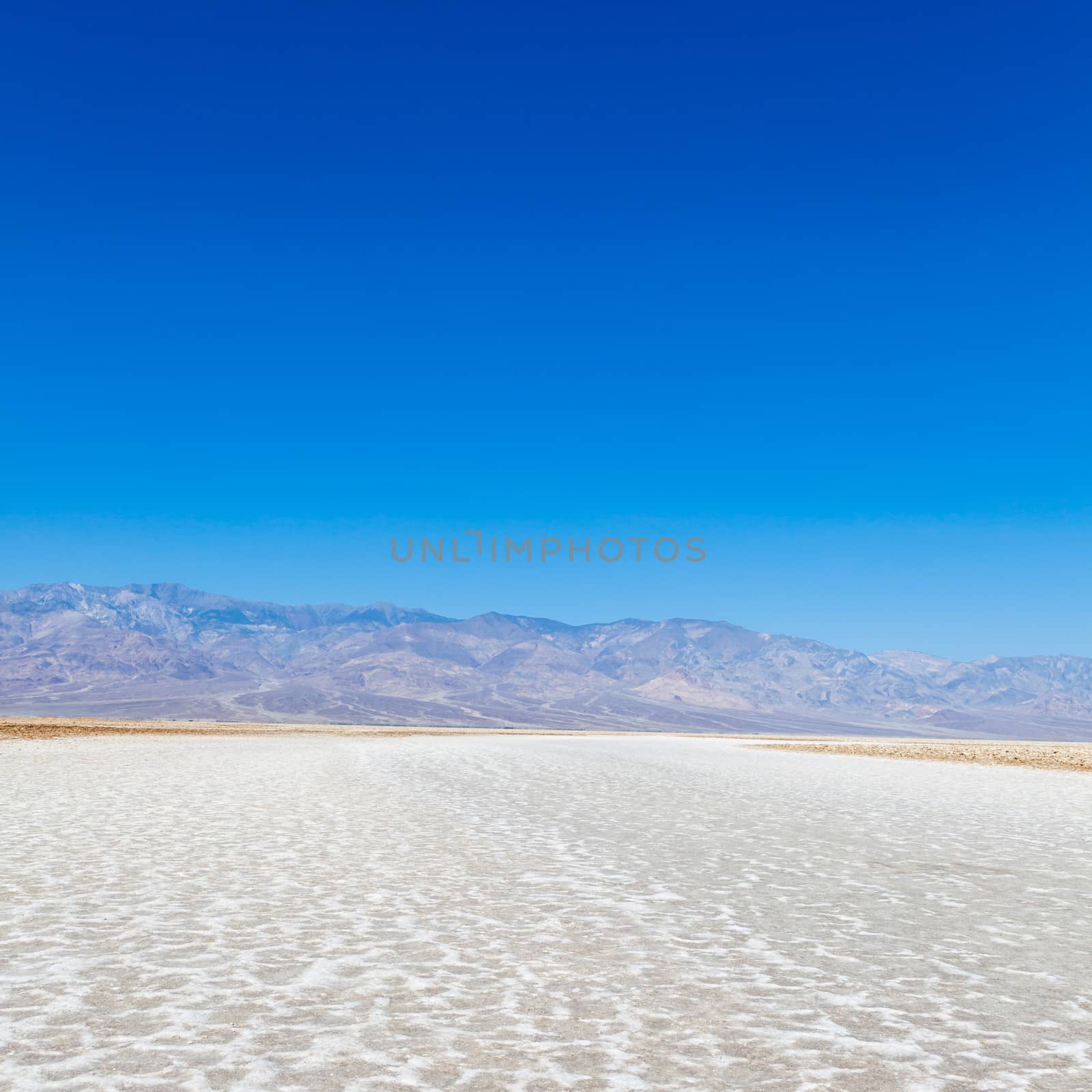 USA, Death Valley. Badwater point: salt road in the middle of the desert