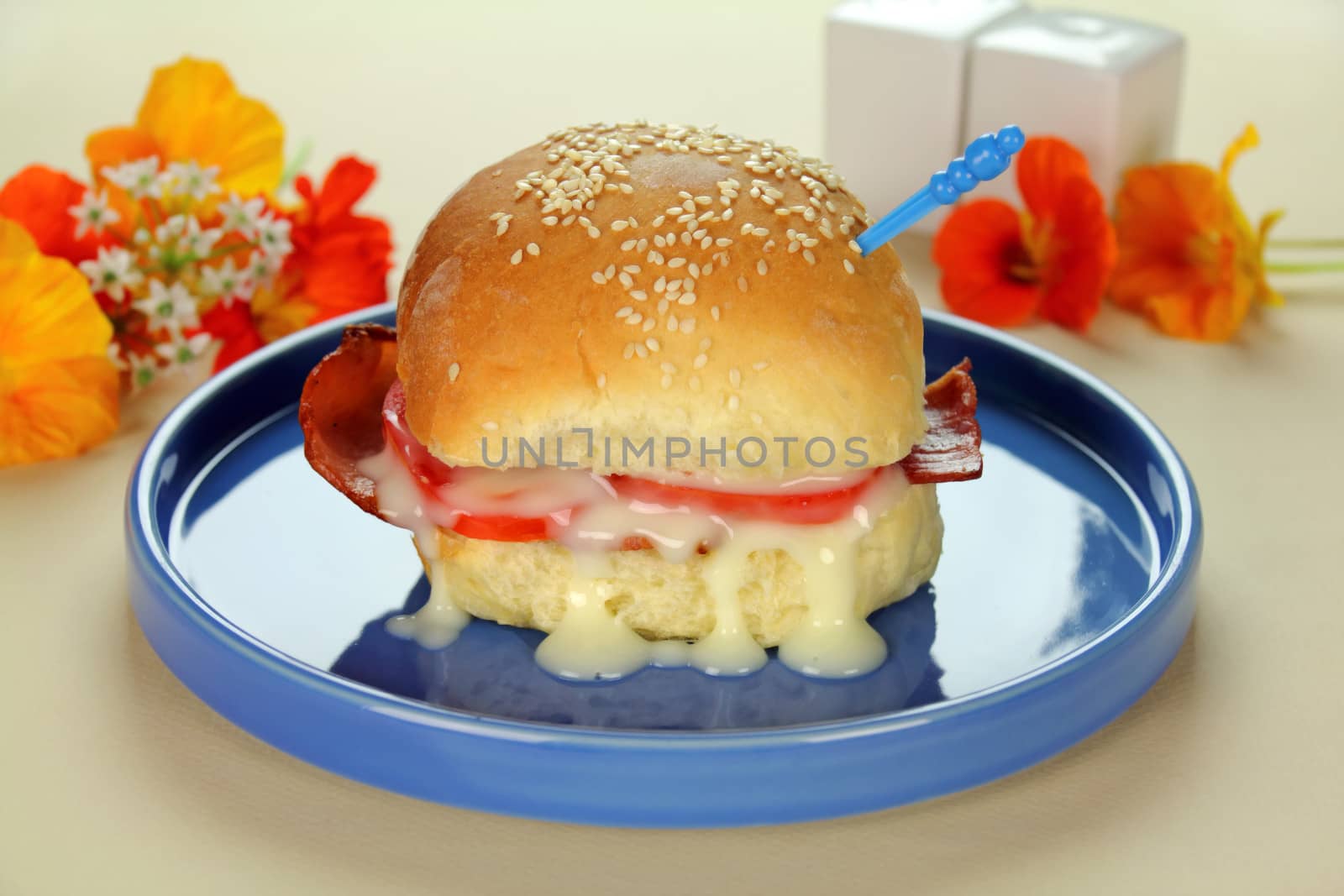 A bacon, lettuce and tomato roll with mayo ready to serve.