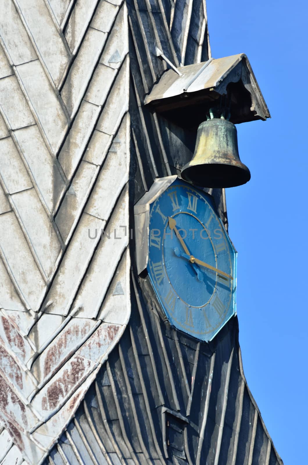 Bell and clock in close up