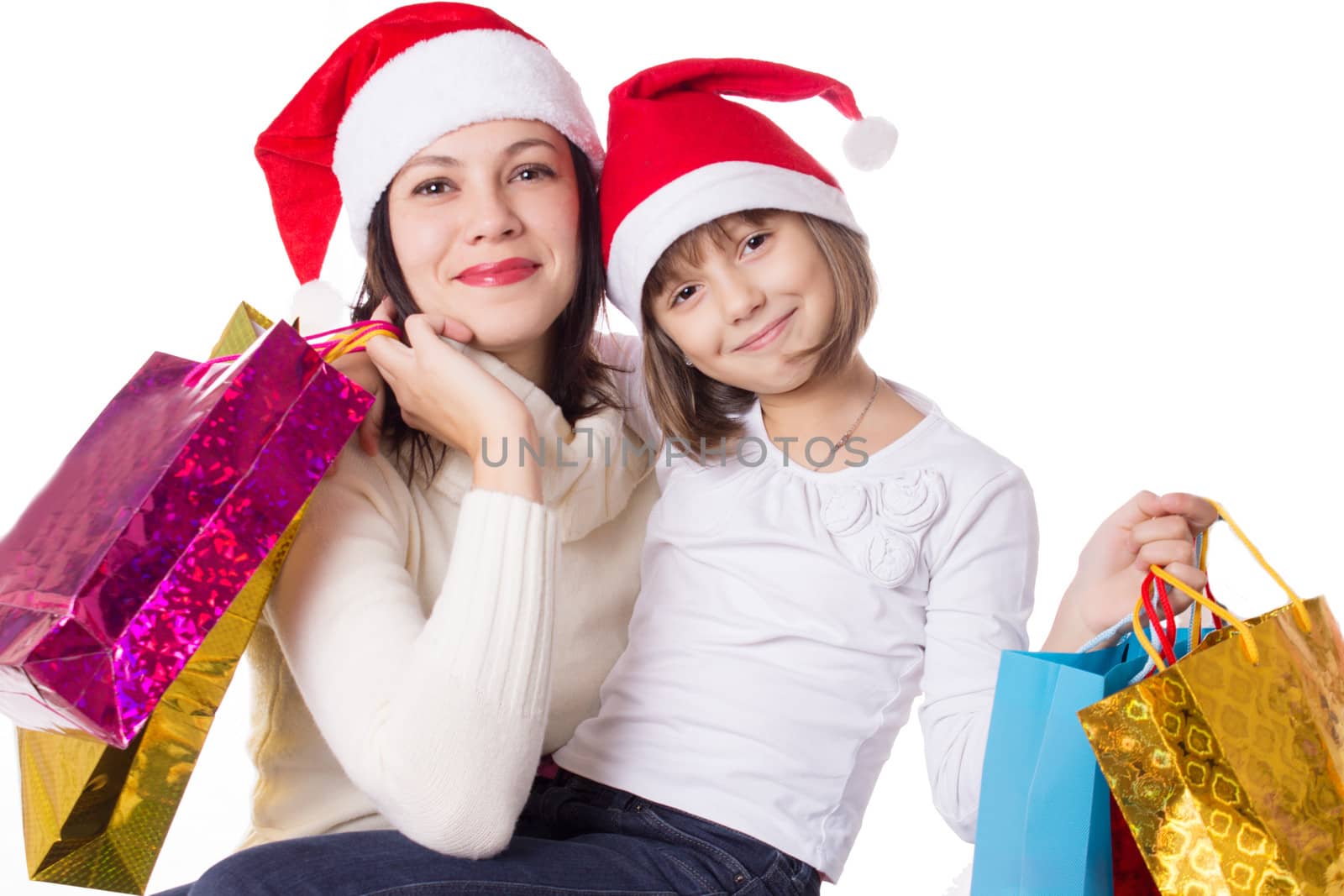 Happy mother and daughter on Christmas shopping isolated on white