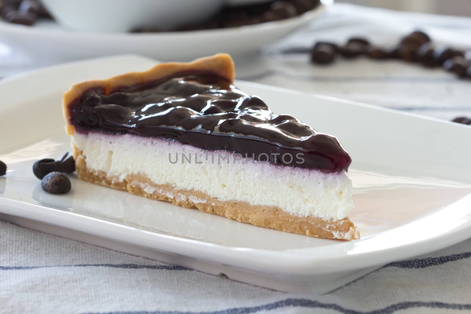 Blueberry cheesecake on white background