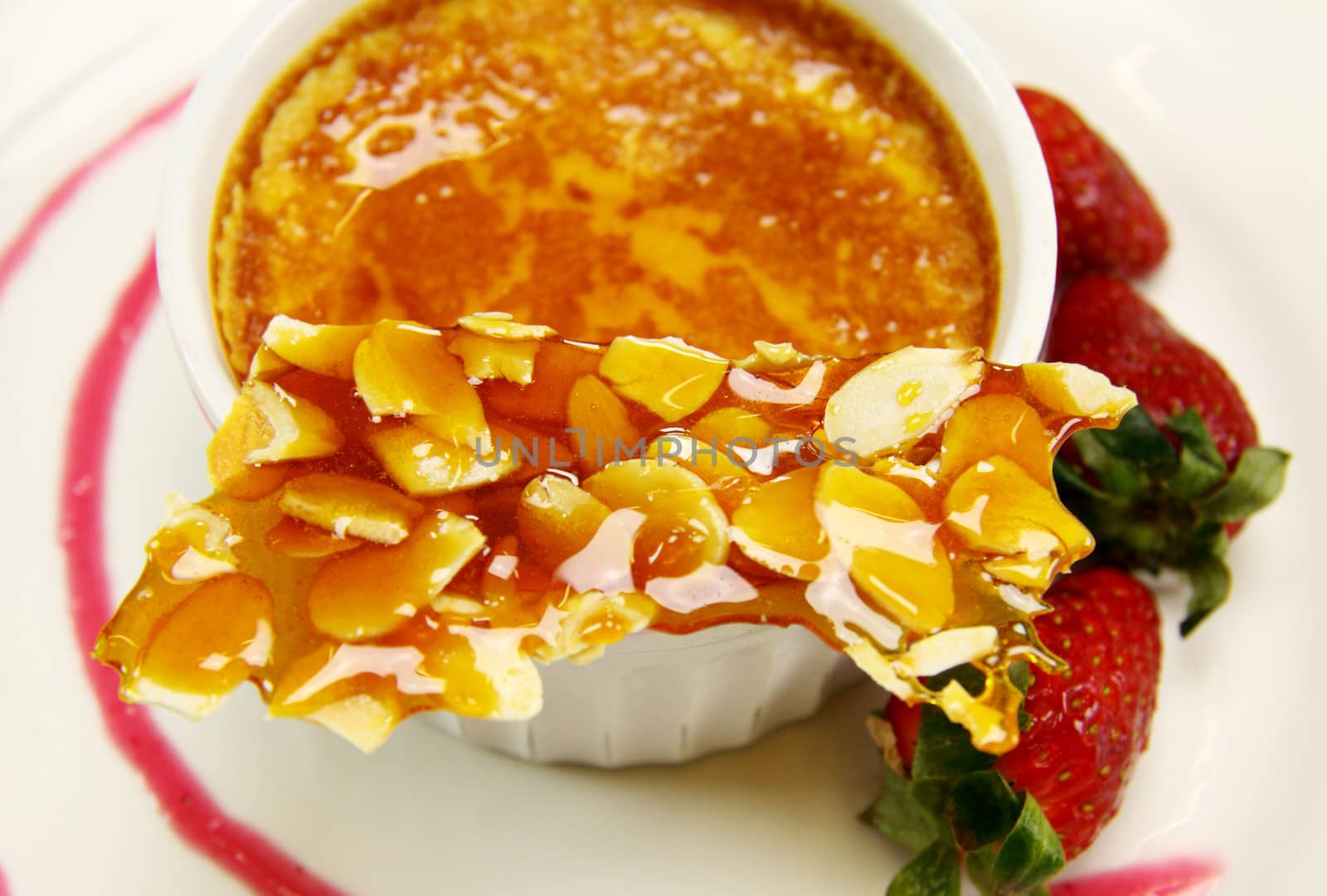Delicious almond praline and baked custard with fresh strawberries.