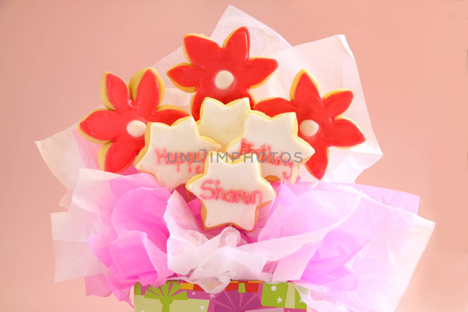 A birthday bouquet made from iced cookies on sticks and gift wrapped.