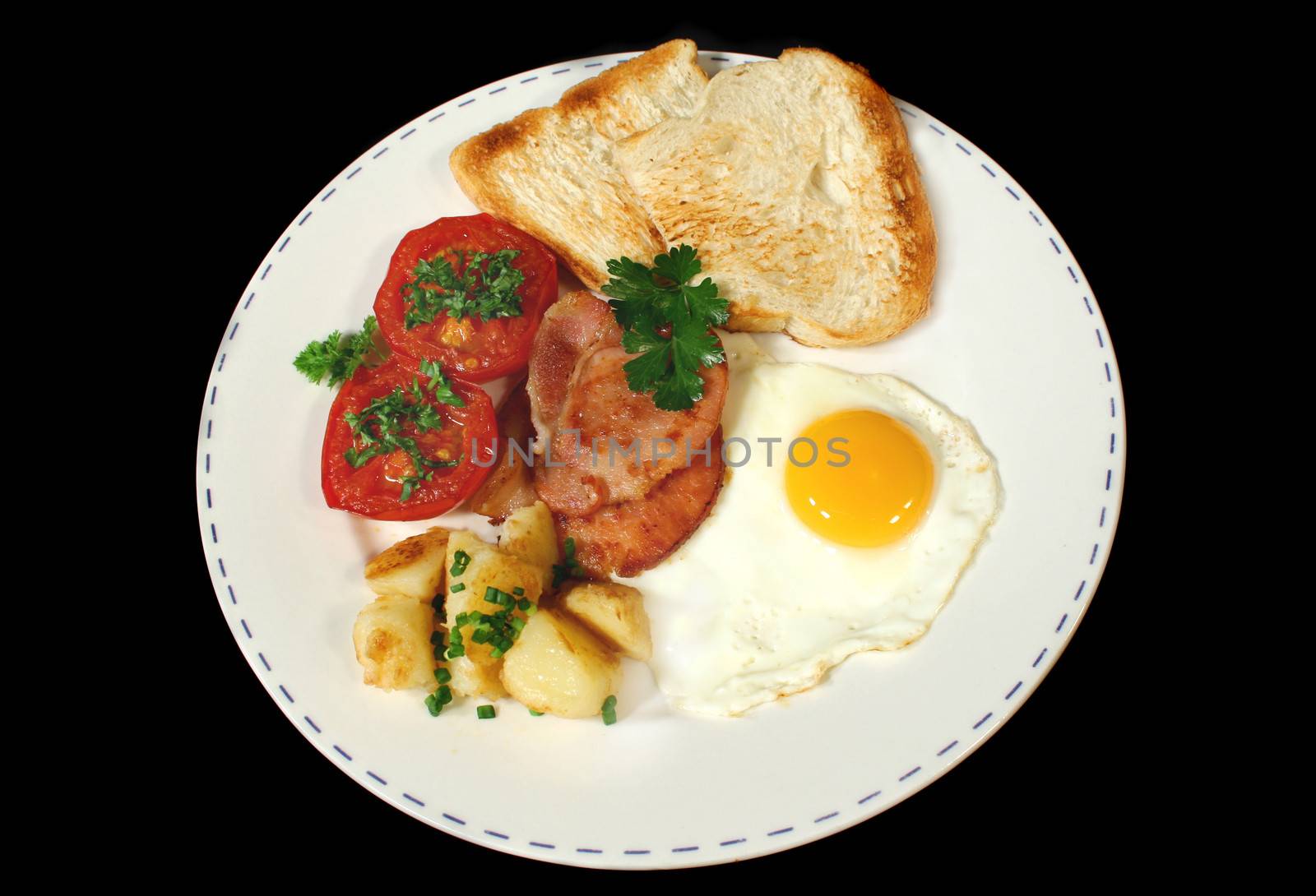 Hearty breakfast of bacon, egg, chips, grilled tomato and toast.