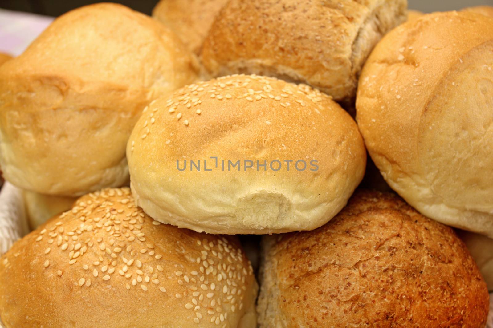 Selection of different round bread rolls ready to serve.