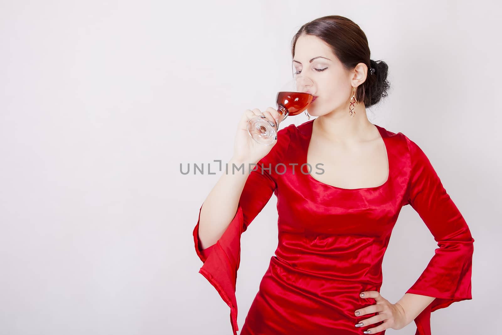 Beautiful brunette with glass of red wine by dukibu