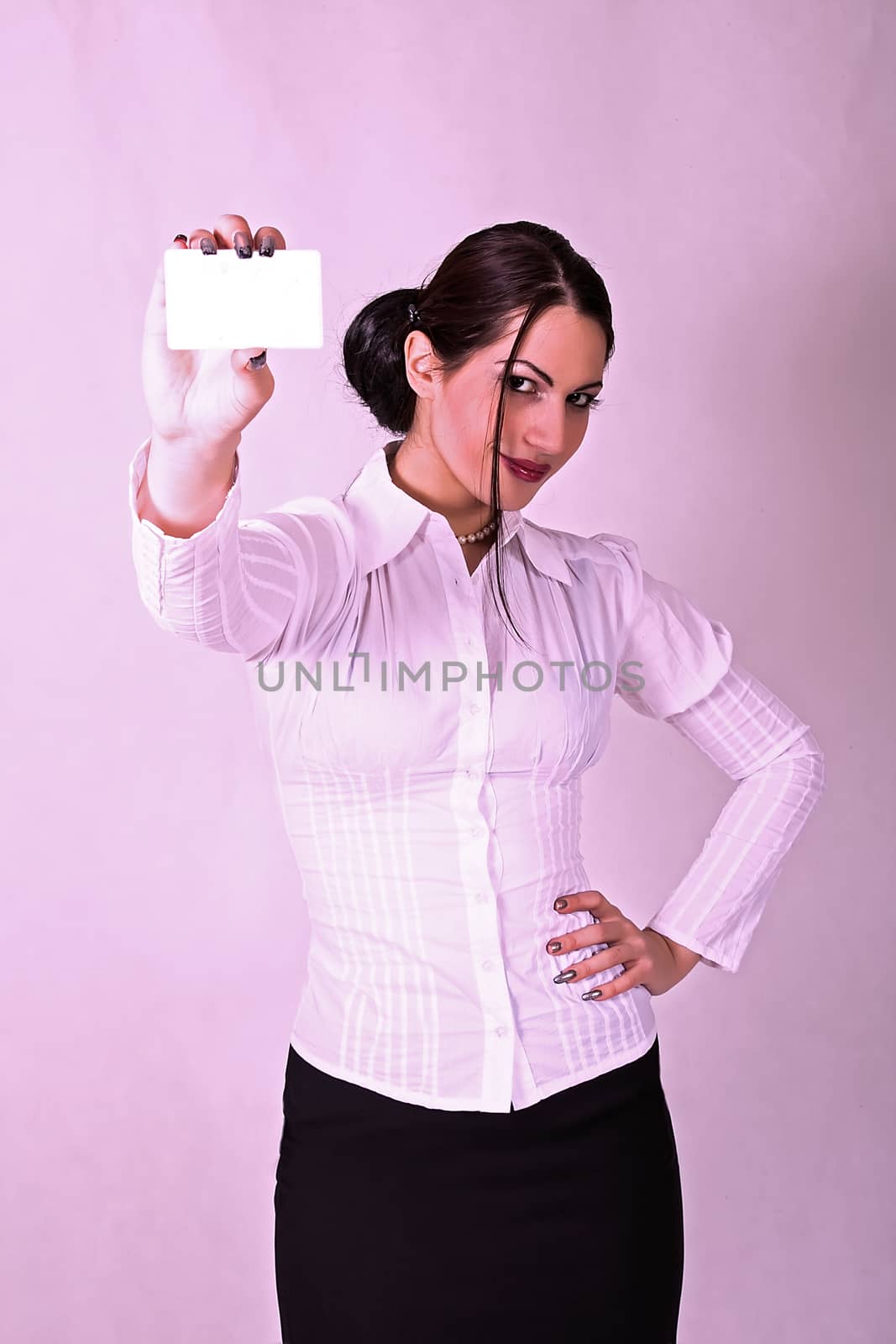 Business woman holding a credit card by dukibu
