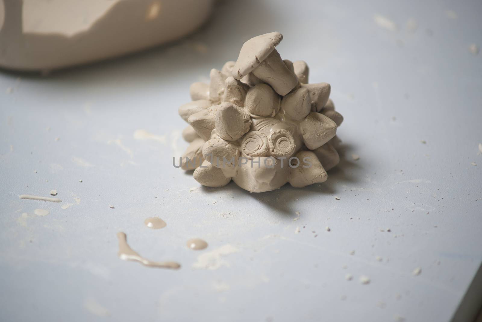 Girl make toyfrom clay. High resolution image.