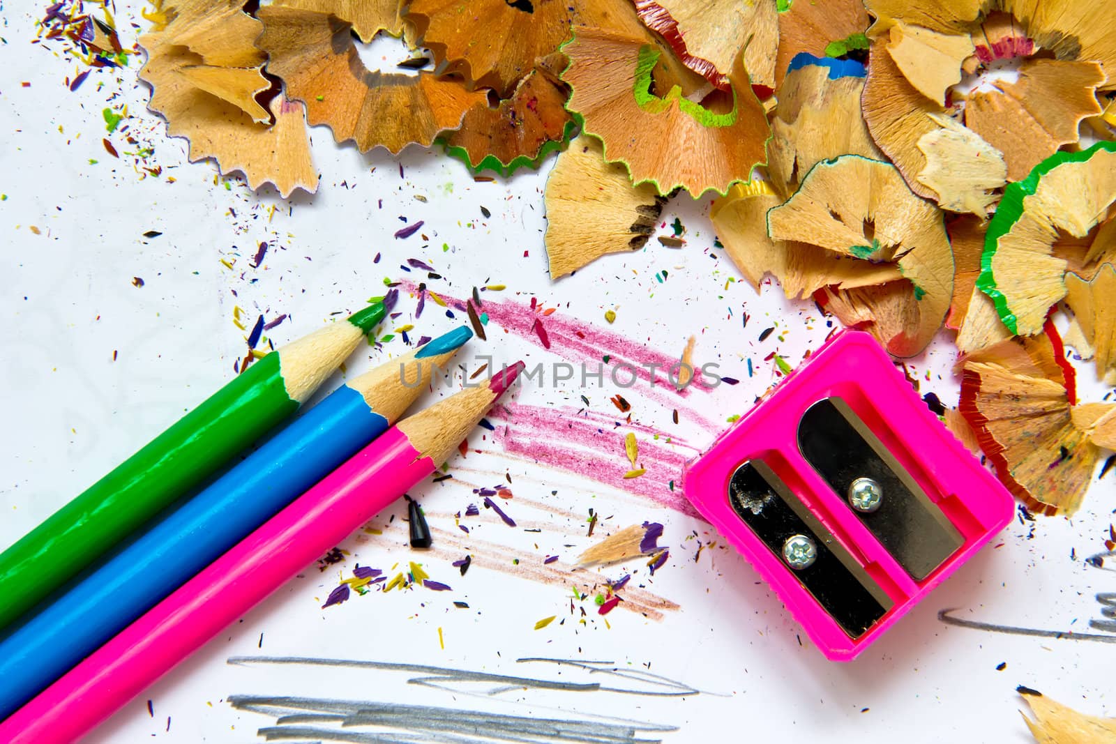 Pencil sharpener waste on a painted background