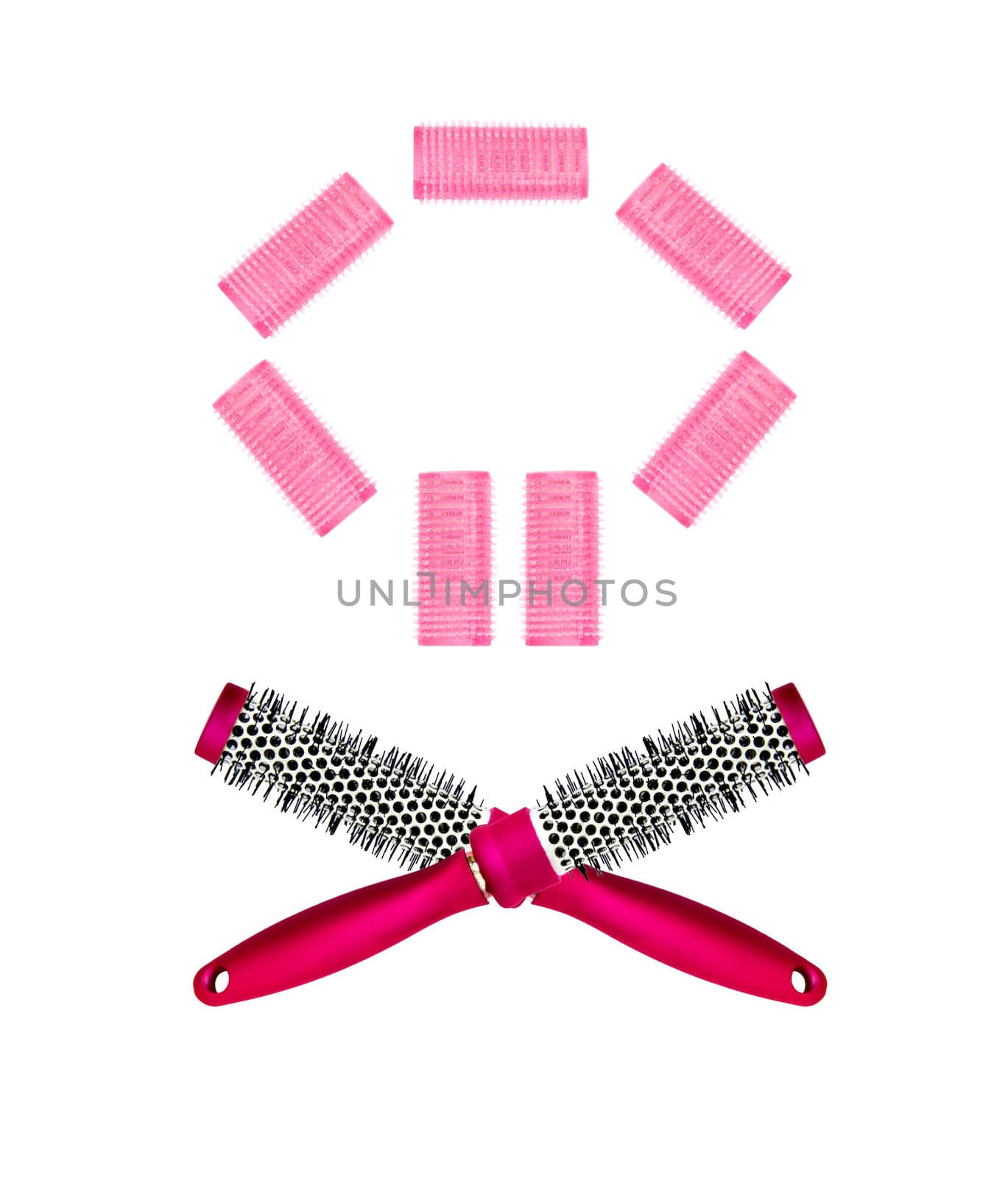 pink hairbrush and curlers isolated on white