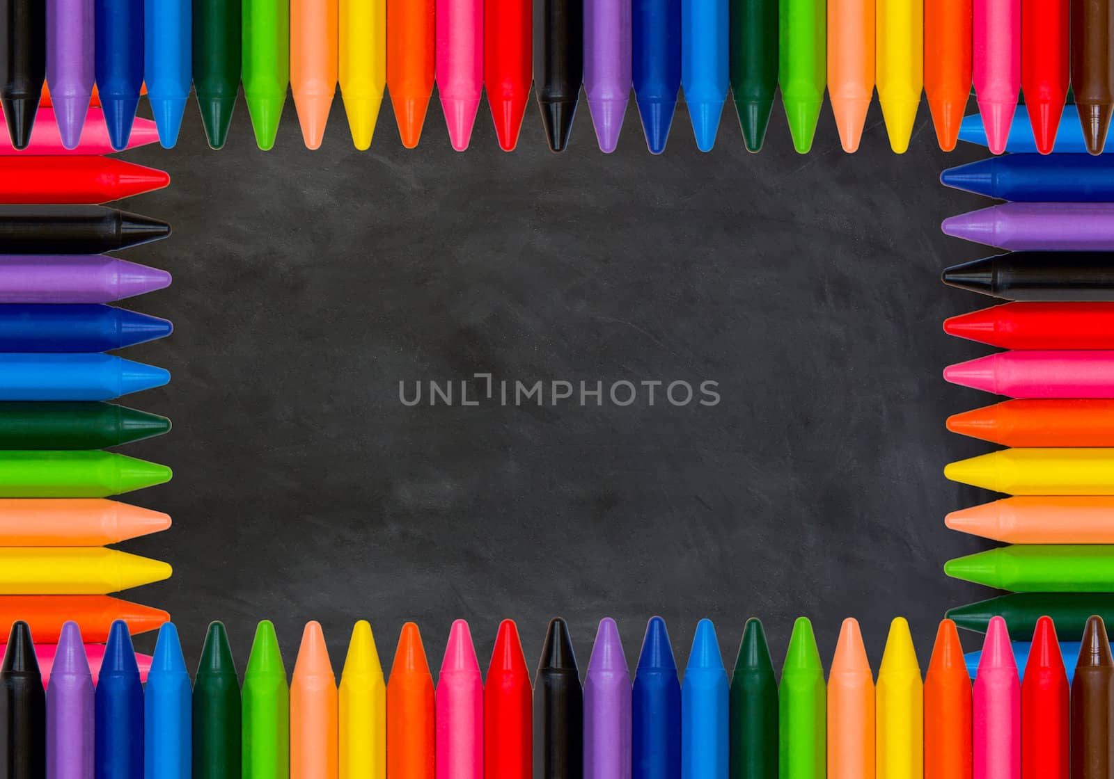 colored pencils on black chalkboard background