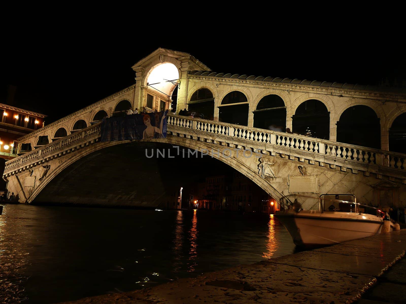 View of the Rialto Bridge at night, Venice, Italy by marcorubino