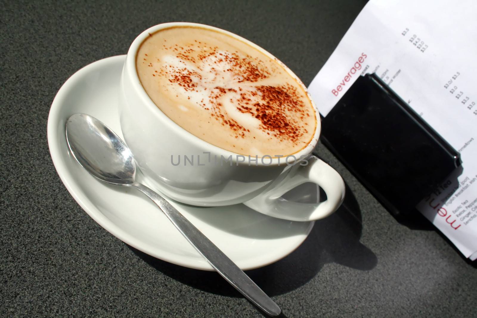 Cappuccino sitting on a table in the morning light.