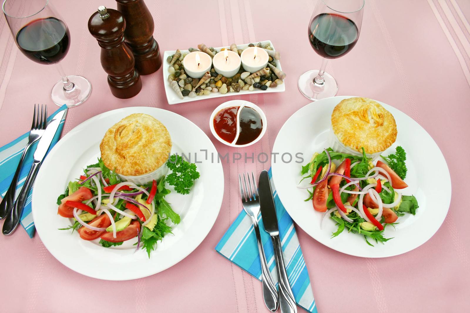 Homestyle chicken and vegetable pies with salad for two.