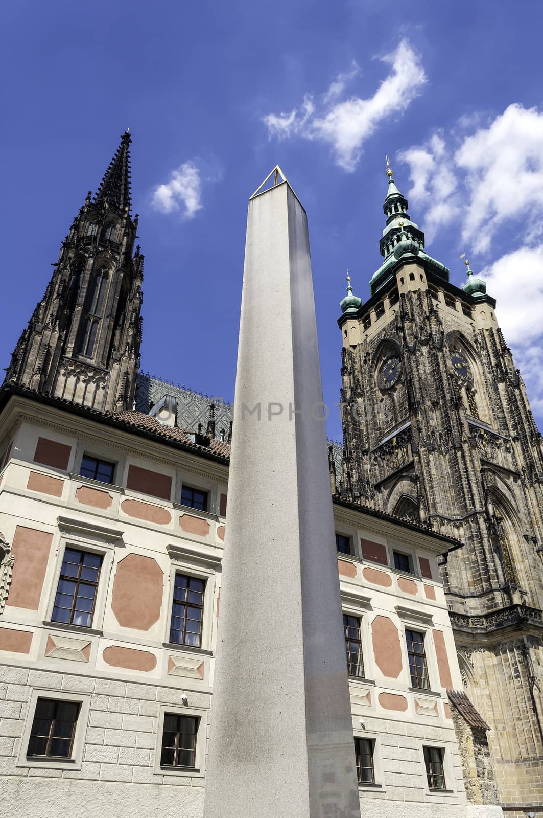 Impressive Saint Vitus Cathedral and obelisk in Prague, Czech Republic.