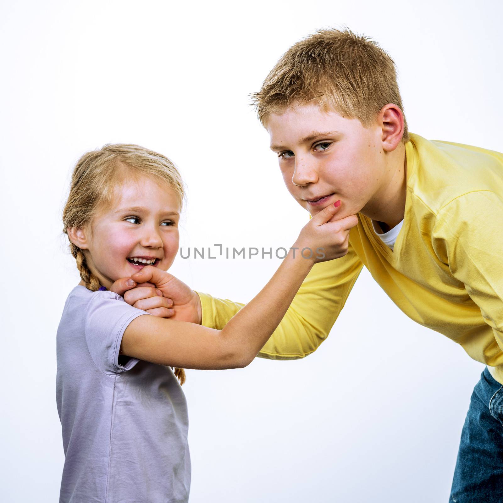 sympaticals and positive chidren have fun on a white bacckgrounf