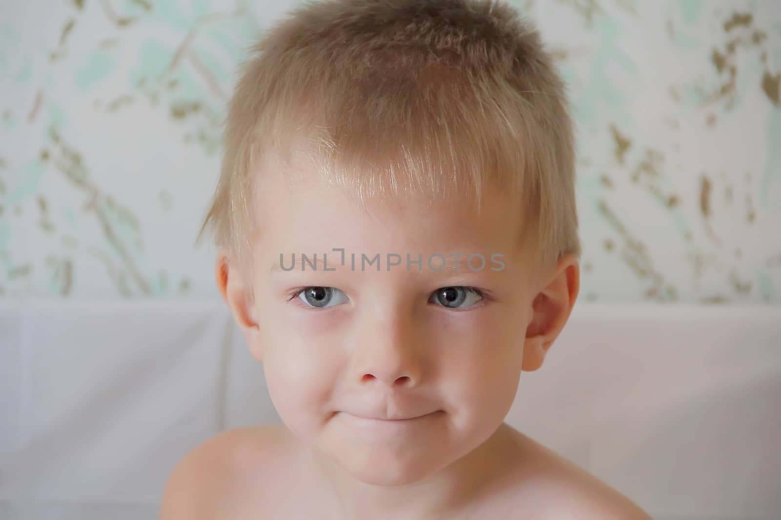 Portrait of cute boy with blue eyes
