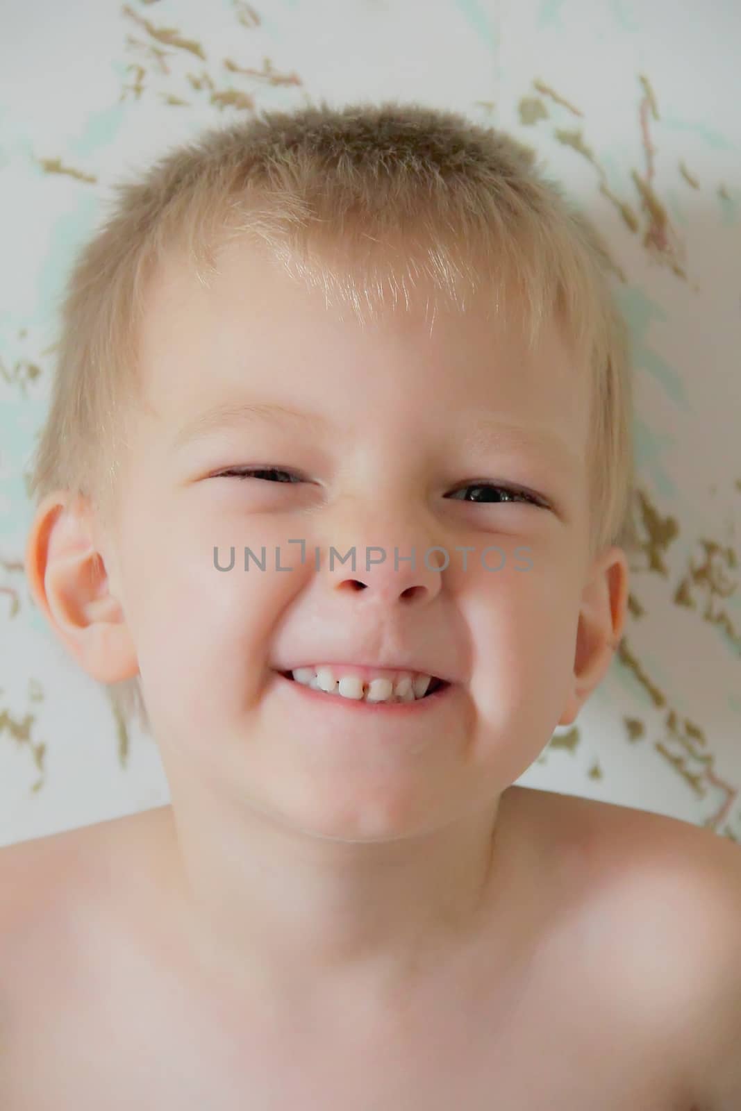 Portrait of cute boy with blue eyes