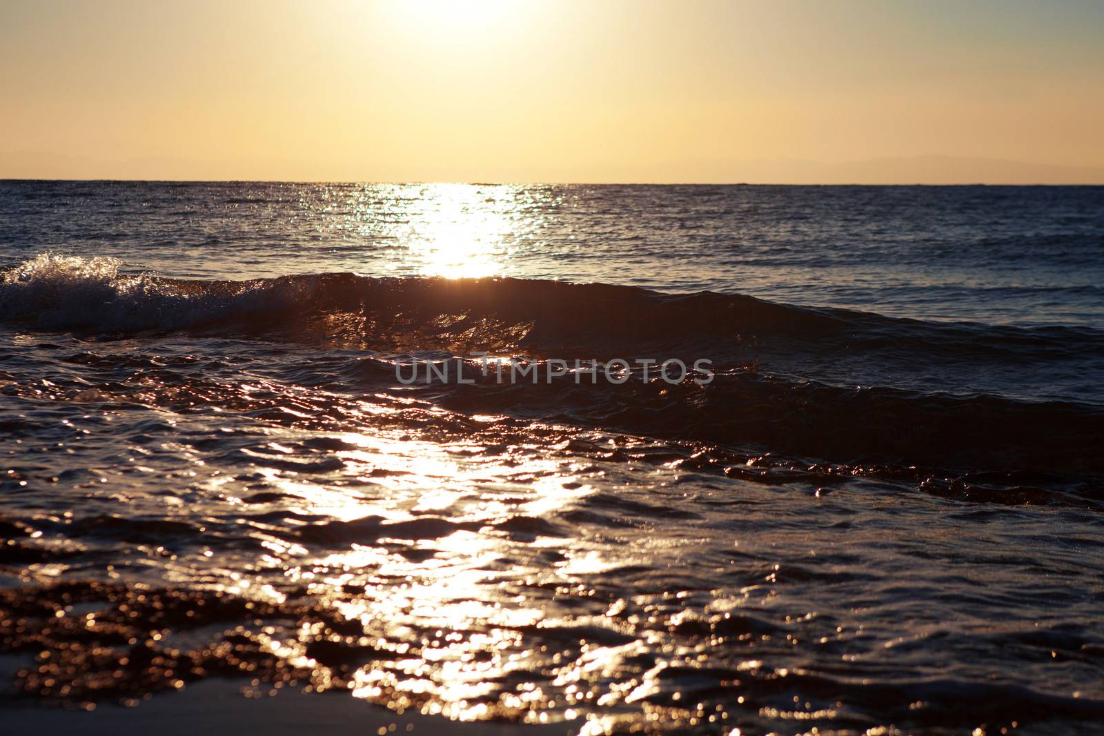 swash on the sea at sunrise by vsurkov