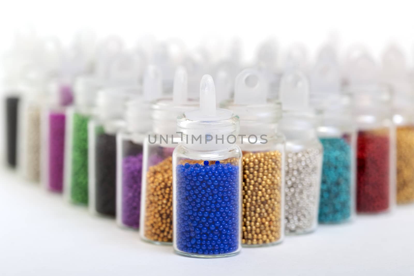 Small Glass Jars filled with Balls of Bead by Discovod