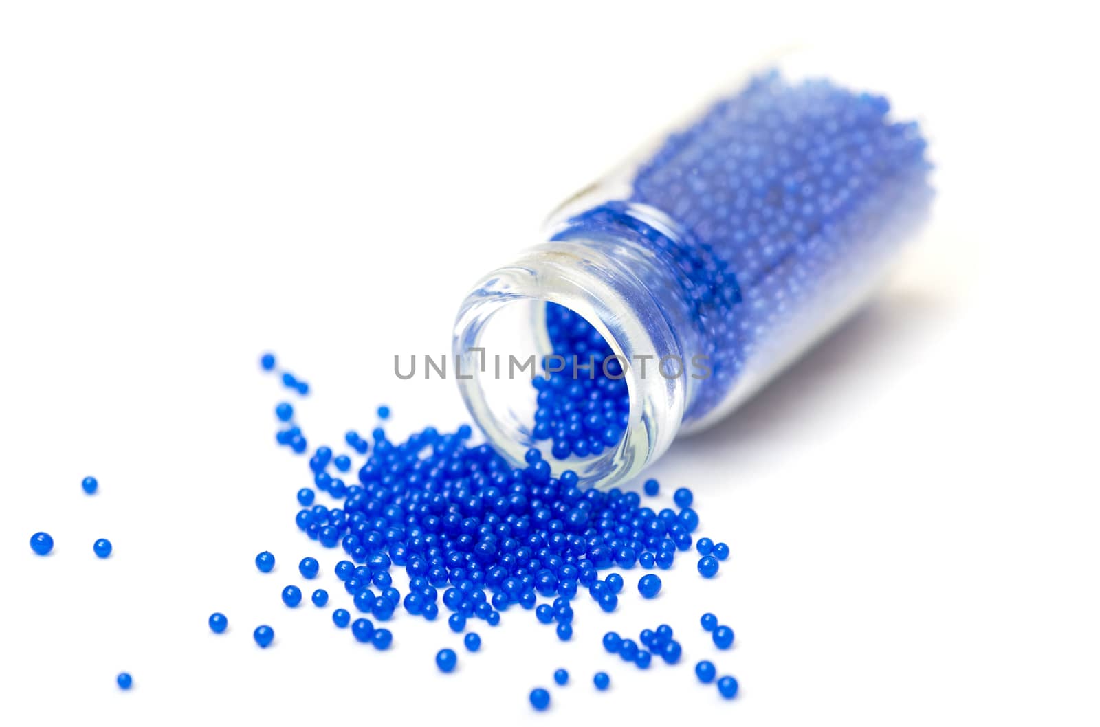 Small Glass Jar filled with Blue Balls of Bead by Discovod