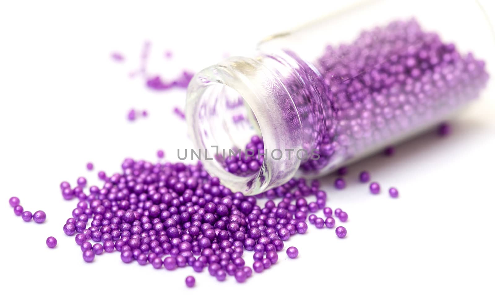 Small Glass Jar filled with Pink Balls of Bead, closeup