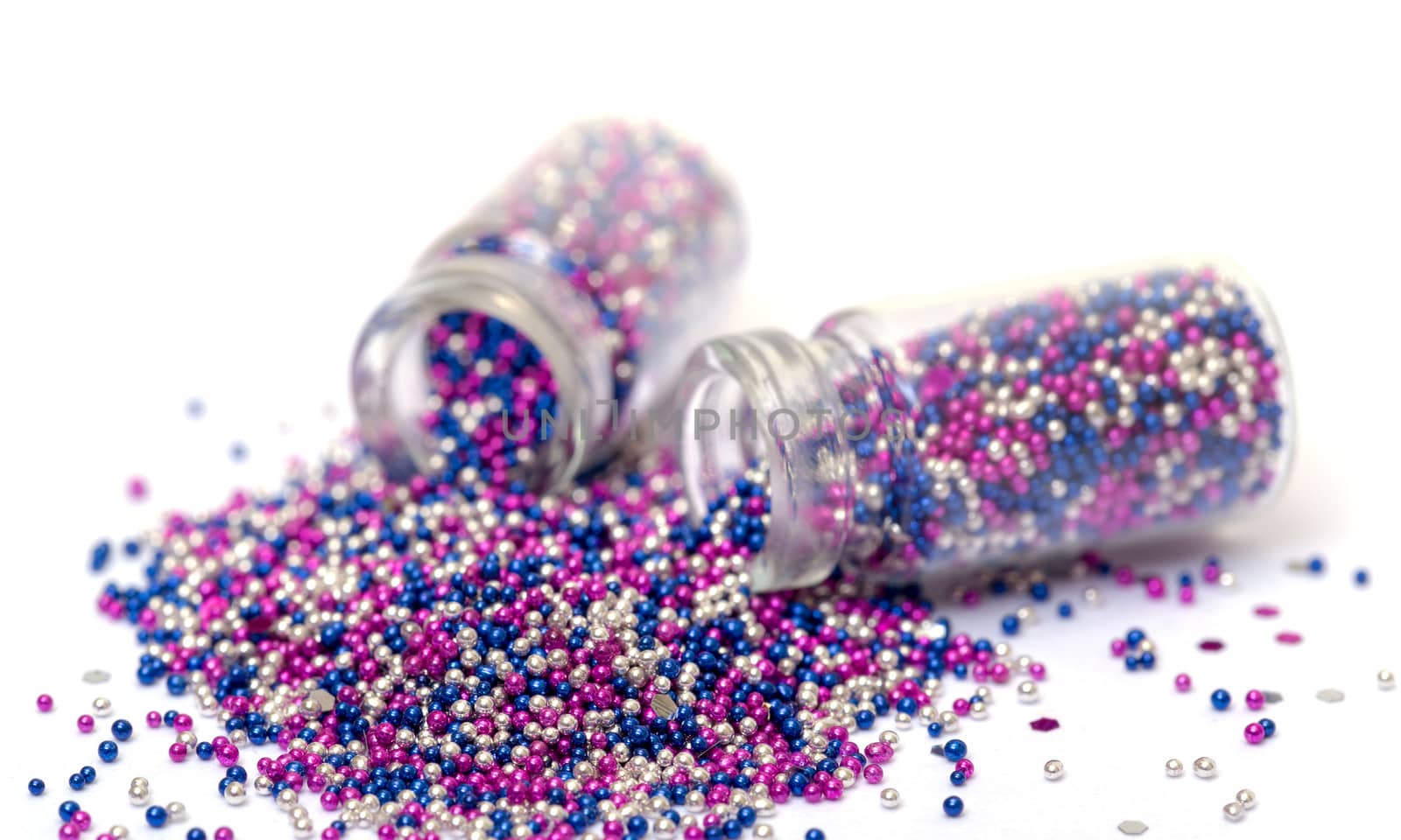 Small Glass Jars filled with Multicolored Balls of Bead, closeup