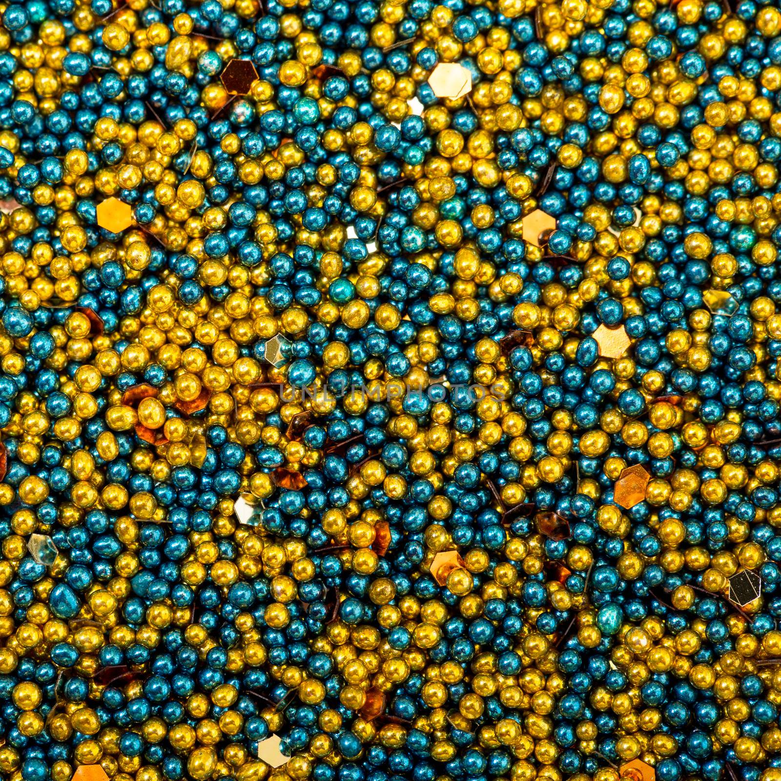 Background from Turquoise and Golden Balls of Bead, nail decoration caviar