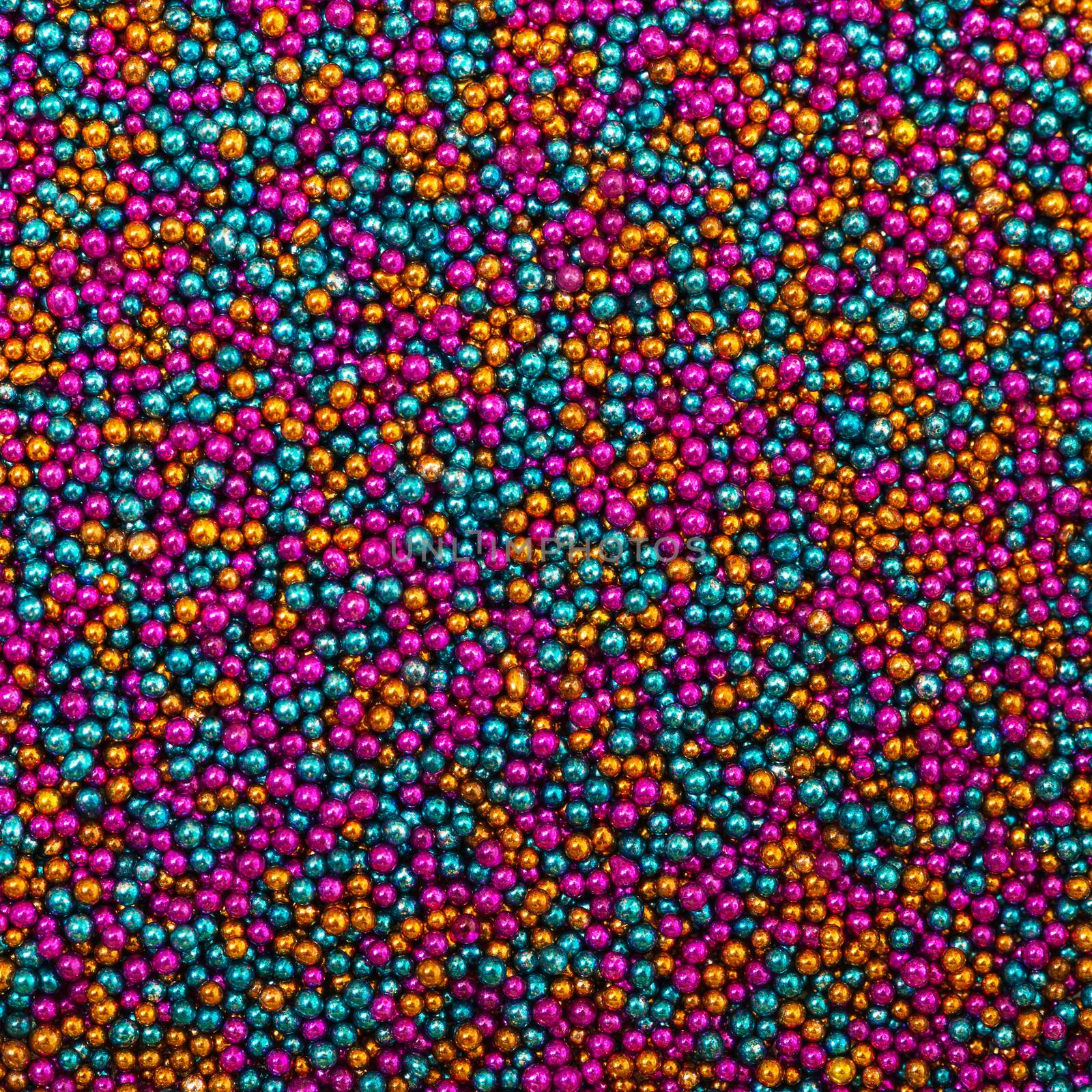 Background from Turquoise, Pink and Golden Balls of Bead, nail decoration caviar