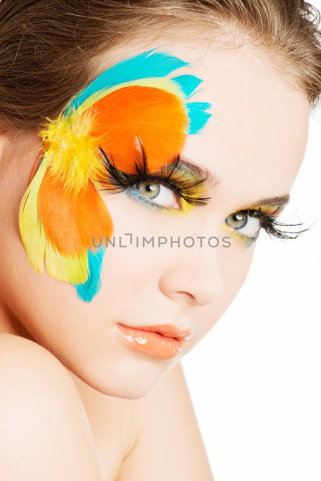Beautiful woman with abstract artistic make up.