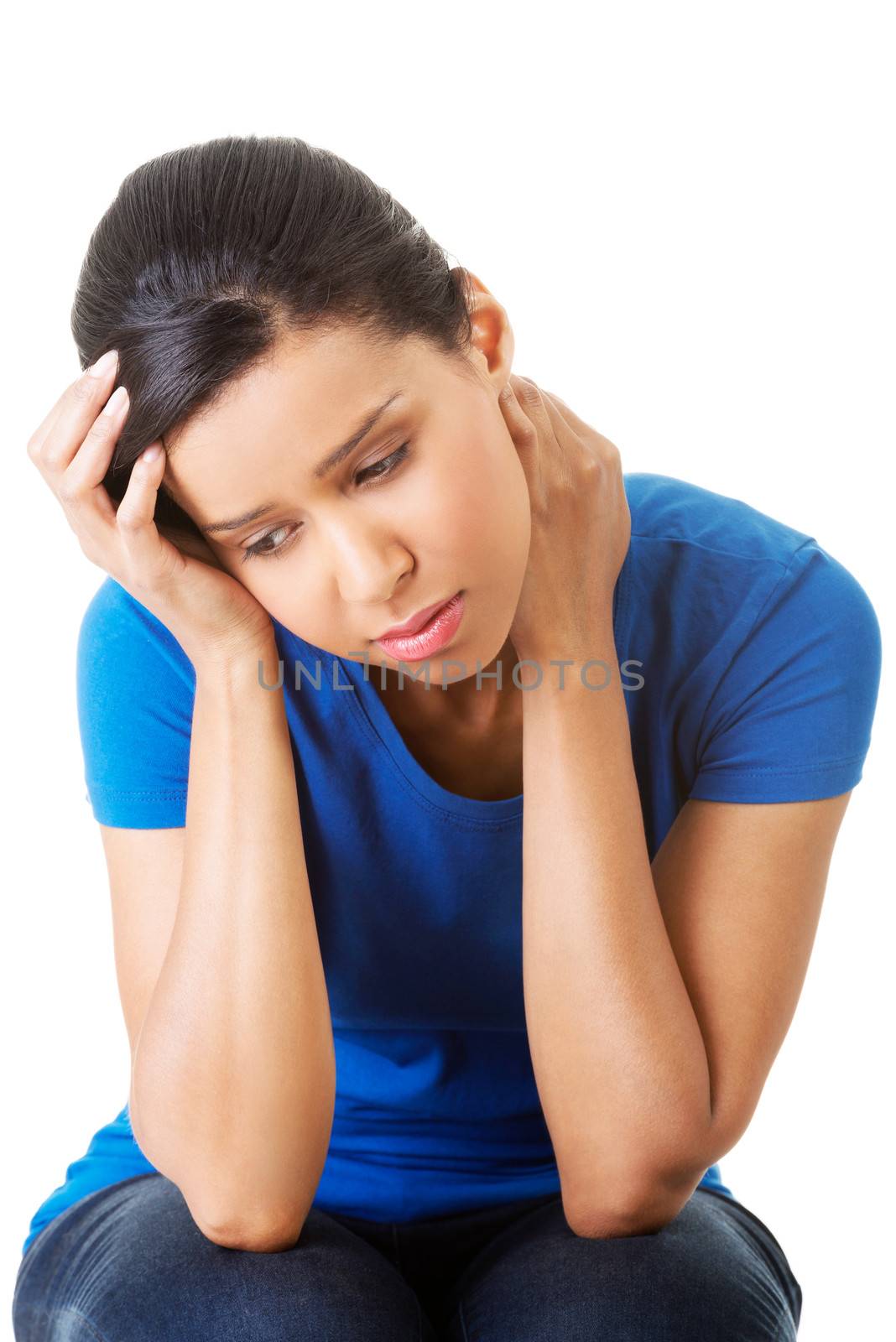 Young beautiful woman in depression. Isolated on white background.