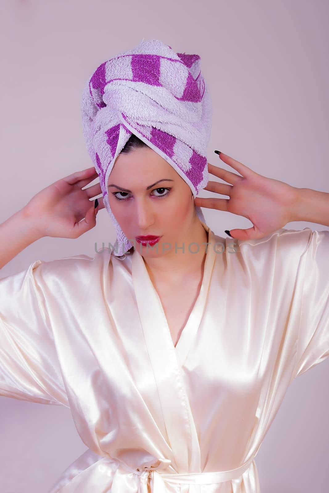 Beautiful woman with a towel on her head by dukibu