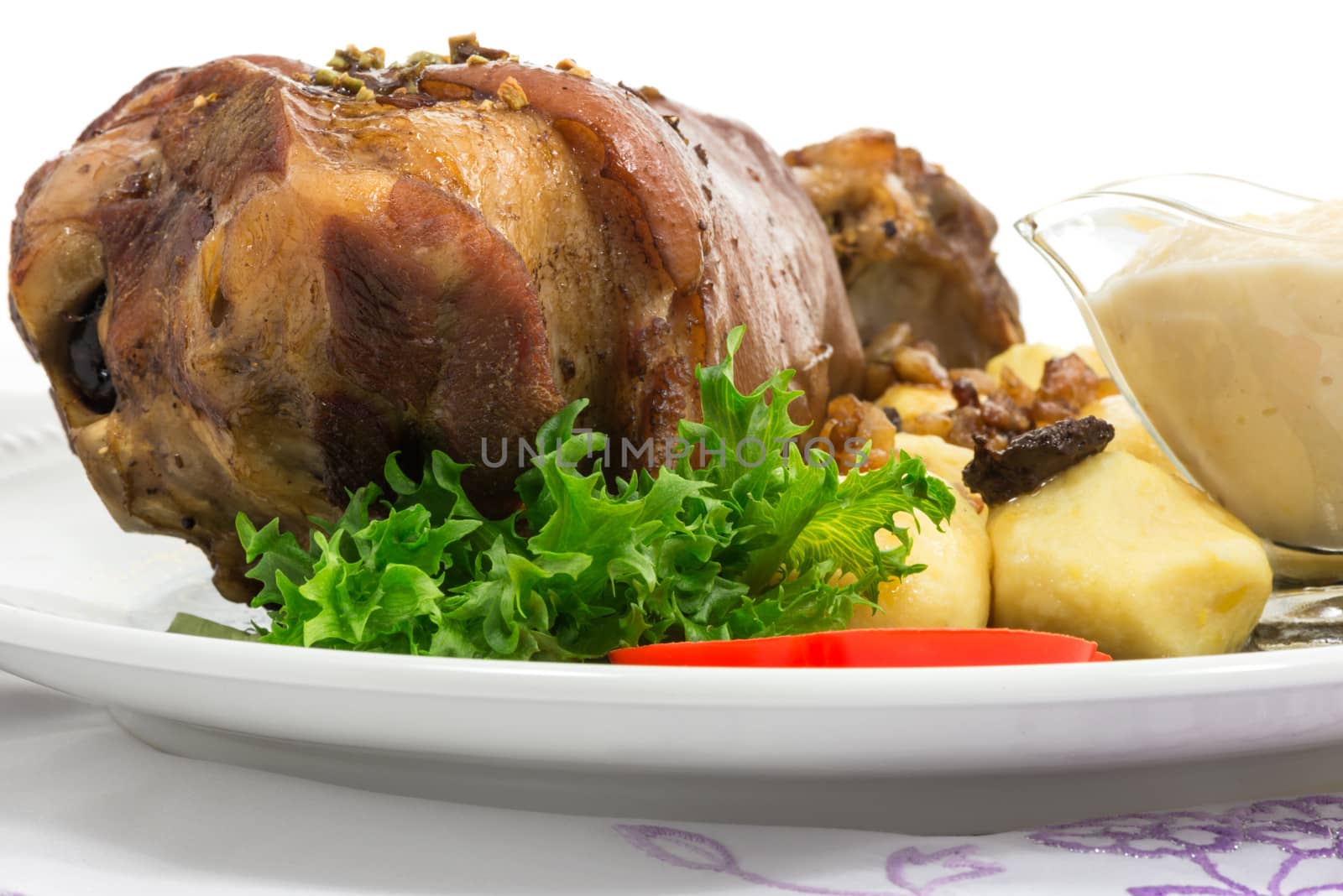 grilled knuckle of pork with potato dumplings with horseradish