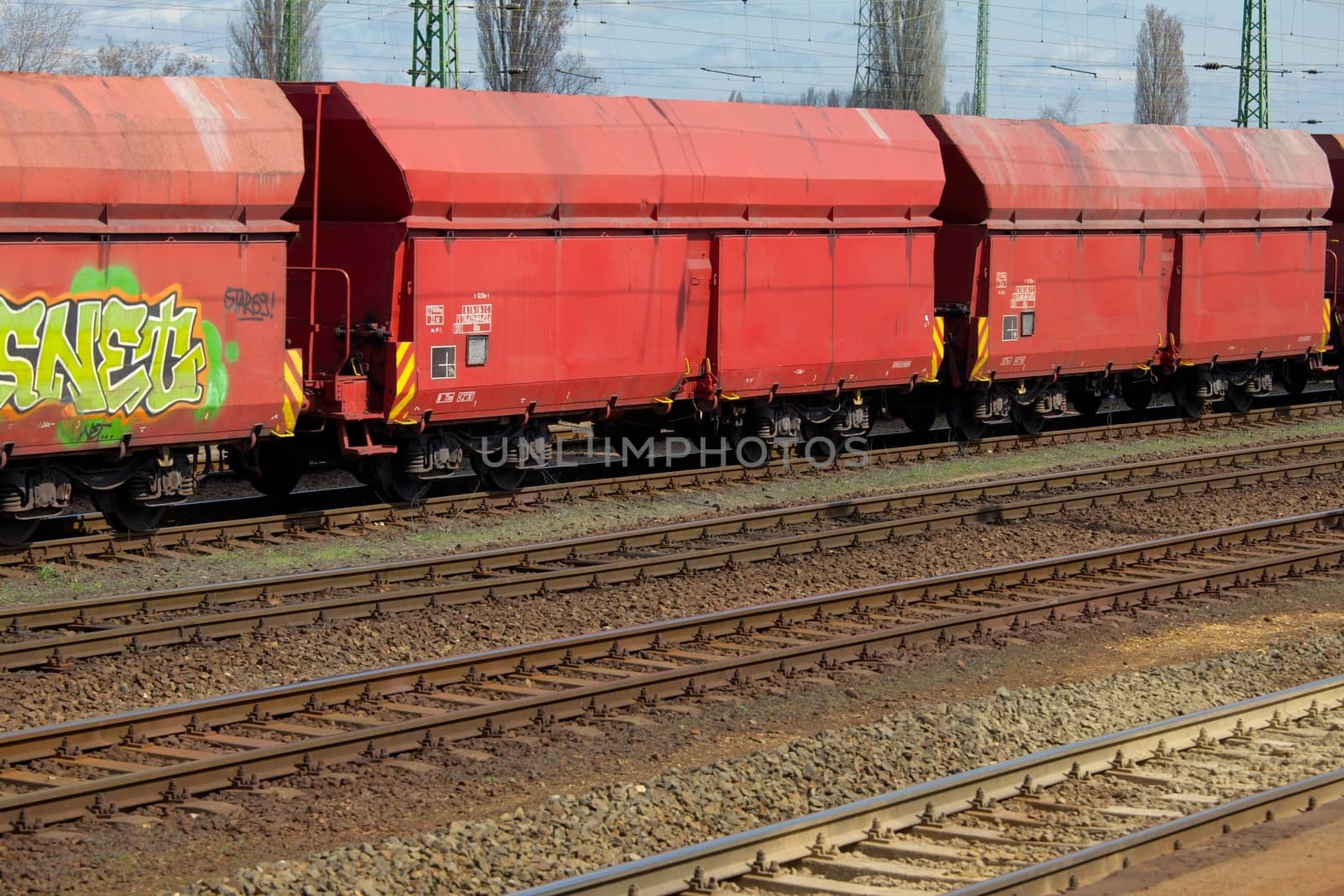 Many railway tracks with freight wagons