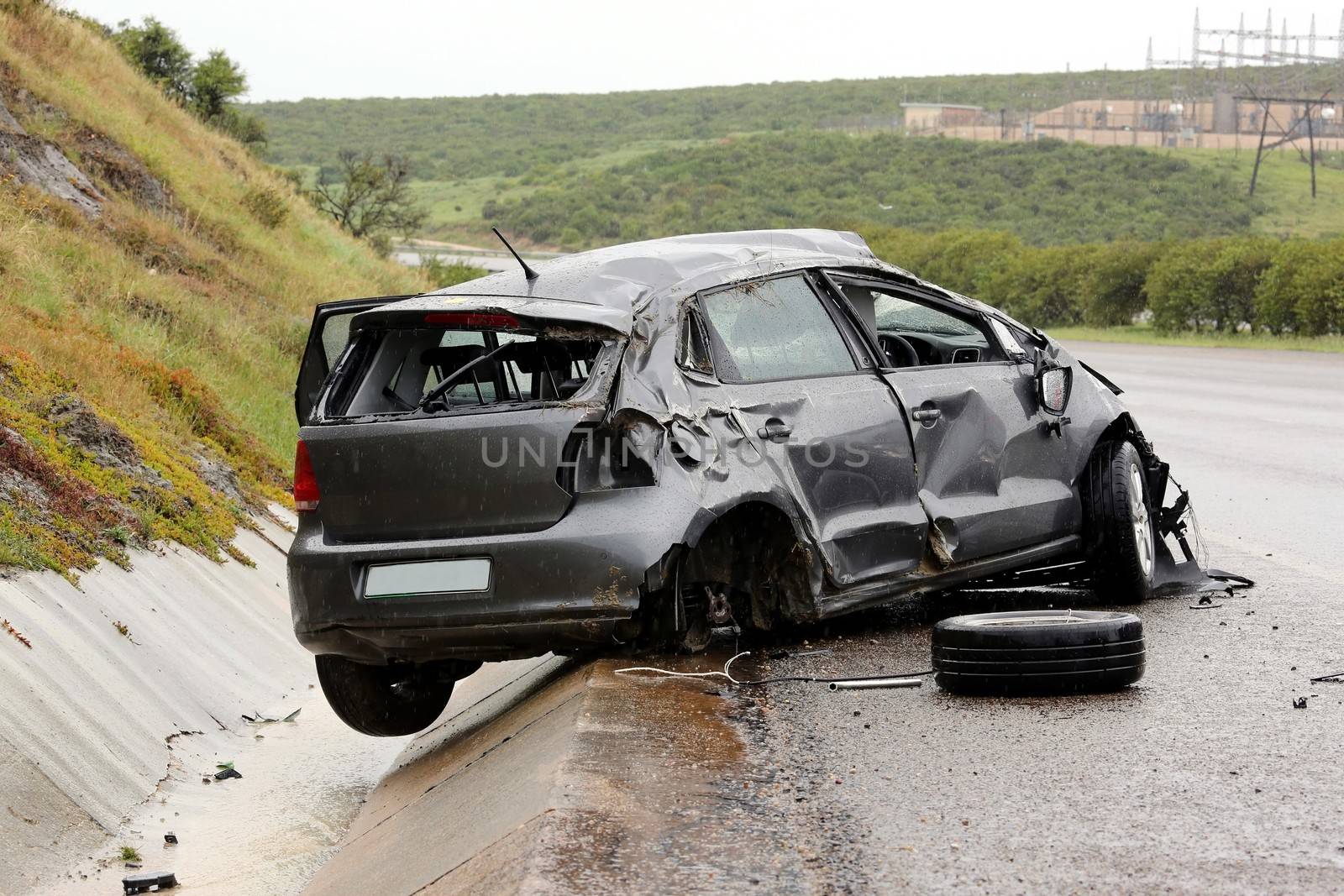 Modern automobile stuck on the road after rolling in the wet weather