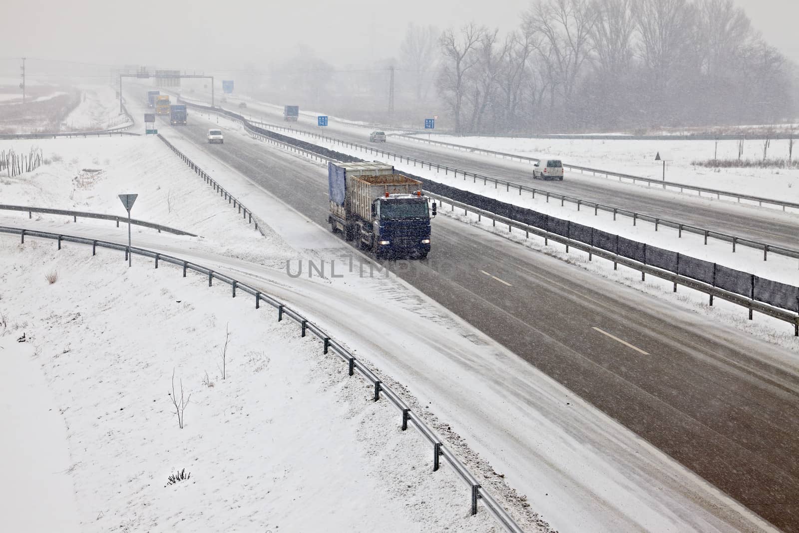 Highway traffic in heavy snowfall