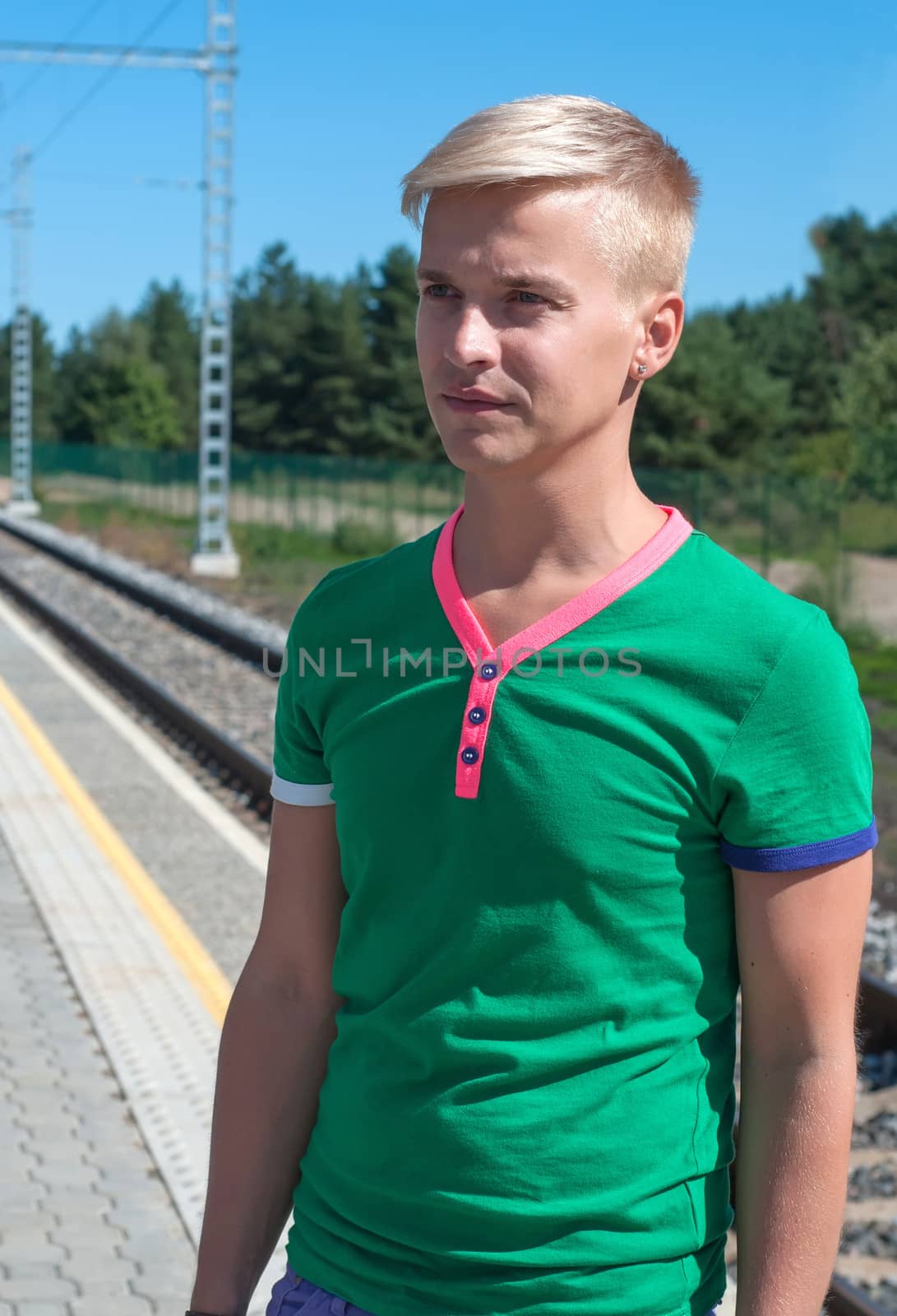 Handsome man standing on platform by anytka