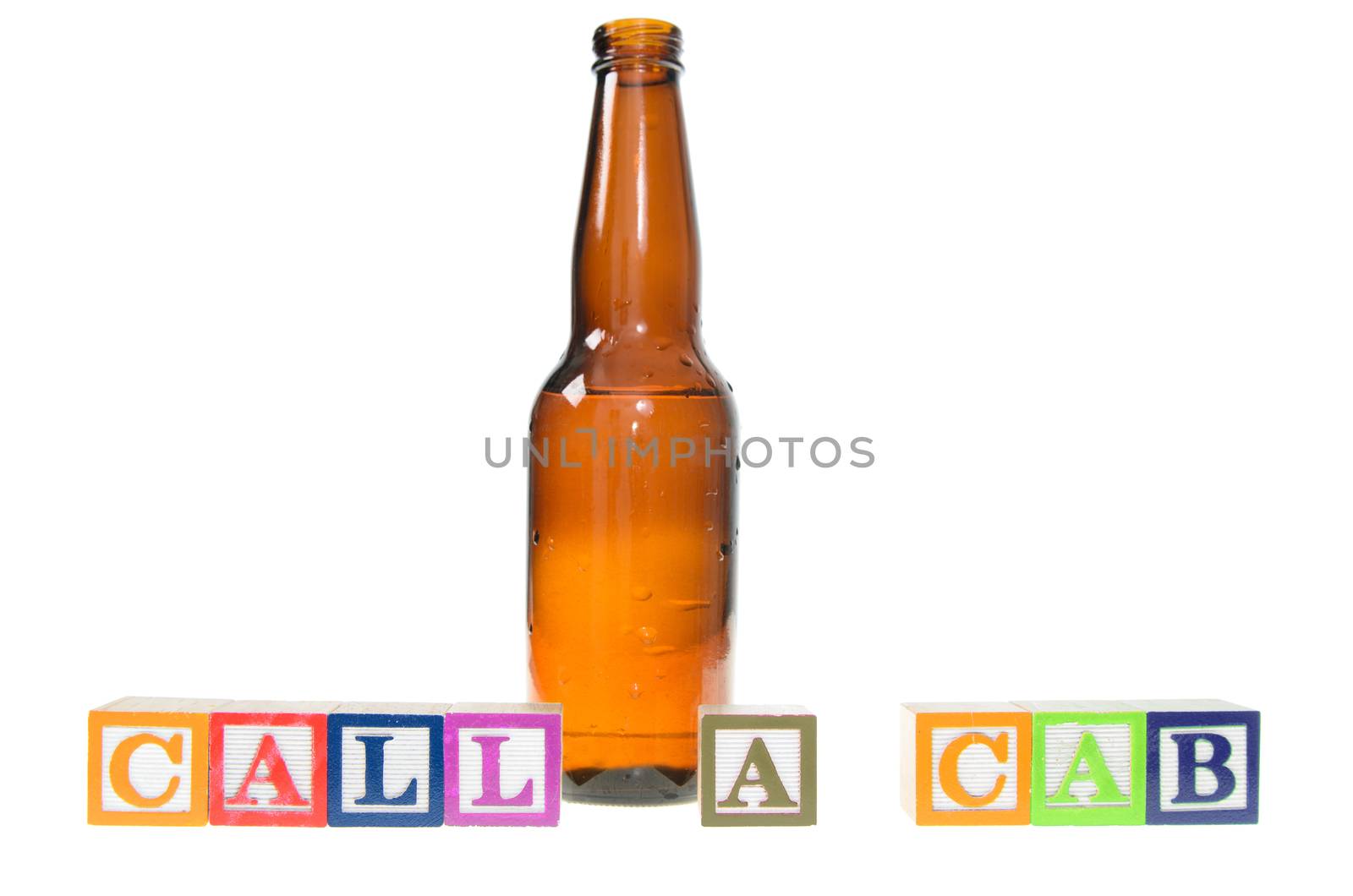 Letter blocks spelling call a cab with a beer bottle. Isolated on a white background.