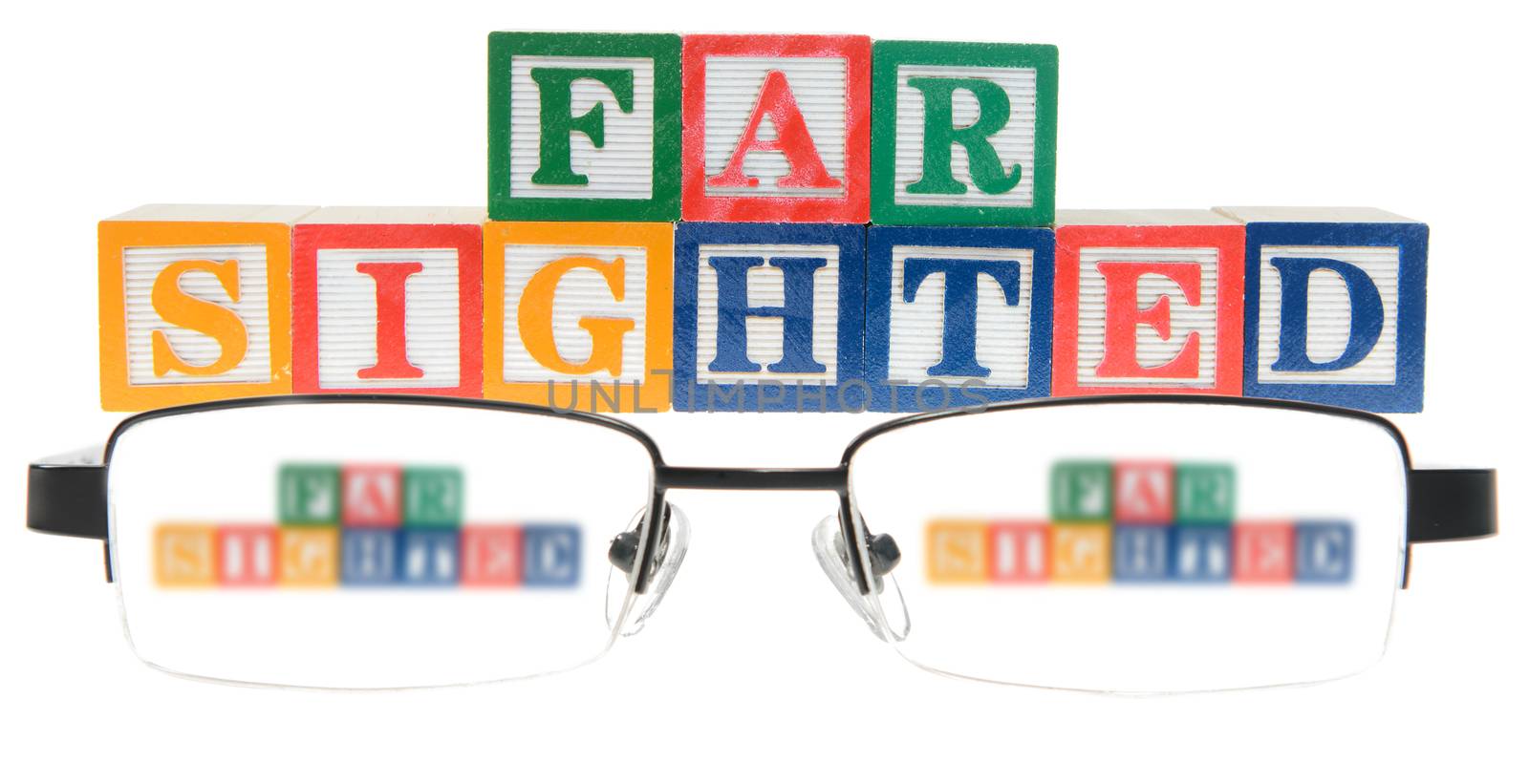 Letter blocks spelling far sighted with a pair of glasses. Isolated on a white background.