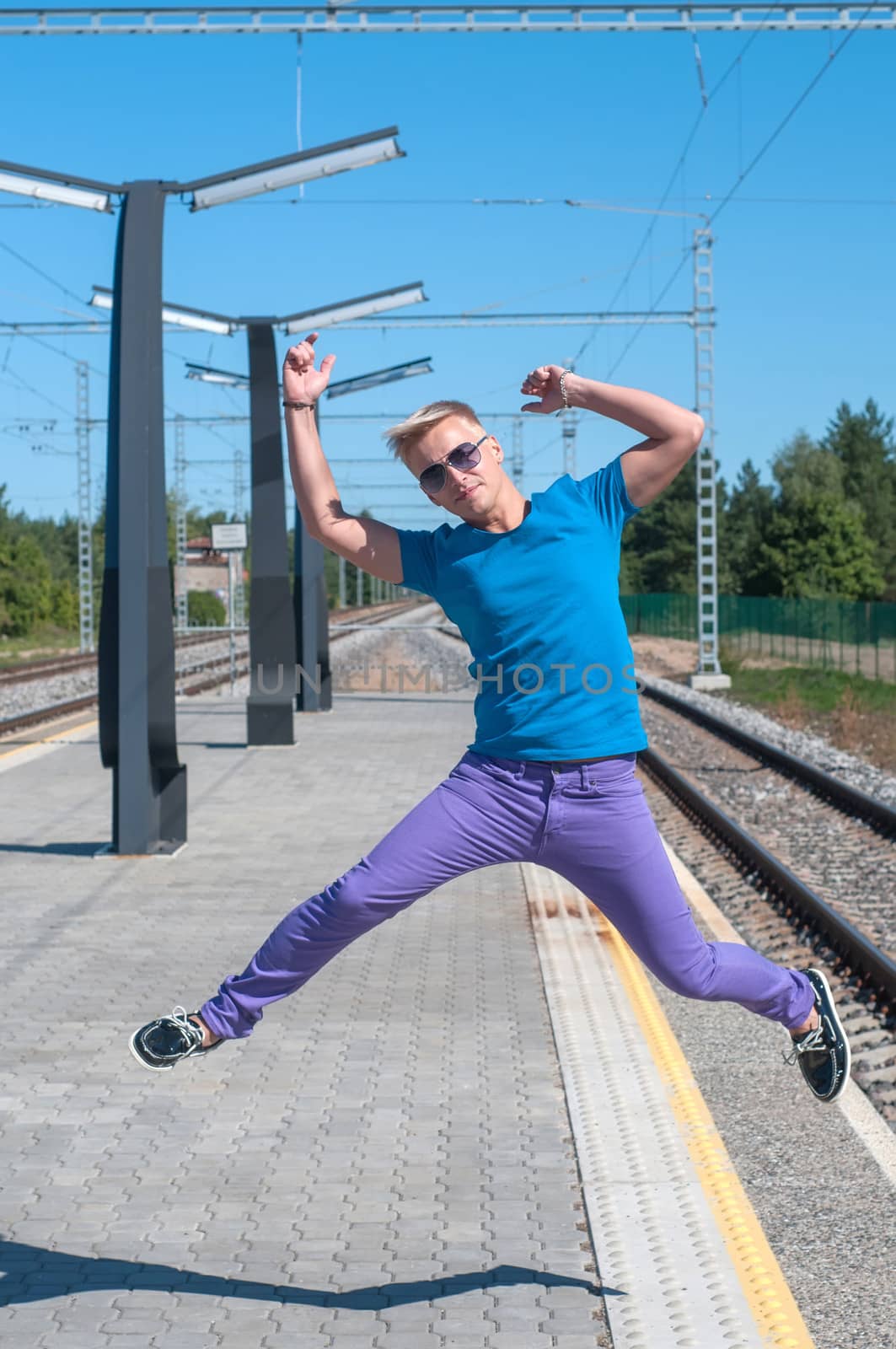 Shot of one man jumping on platform